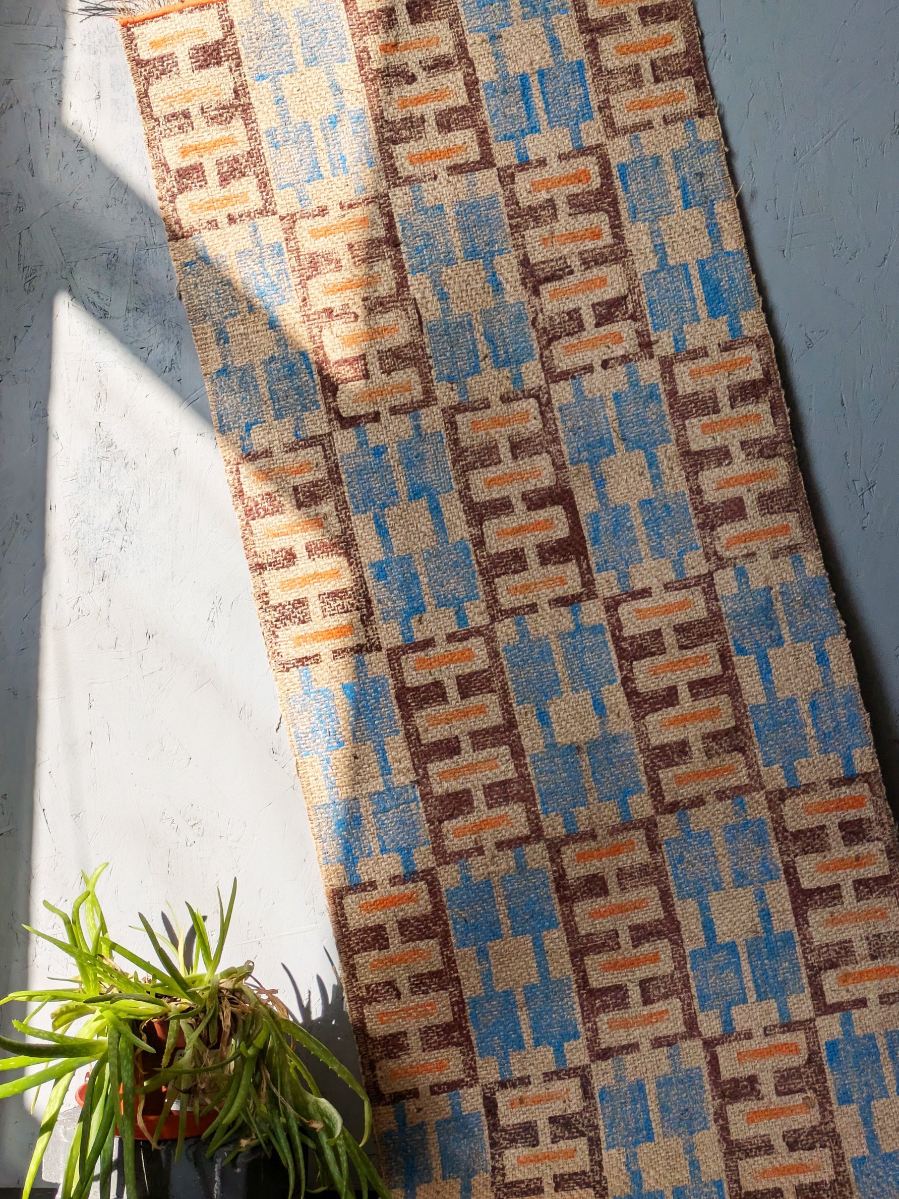 contemporary boho geometric rug design in sunlit studio scene