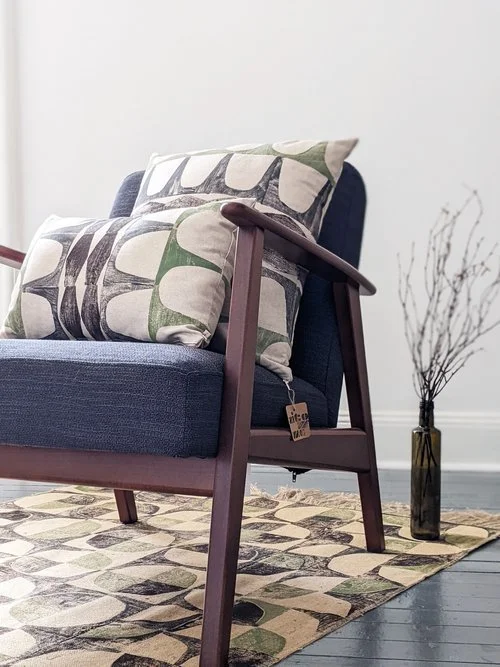 living room scene with rug and seat in abstract geometric 1960s style