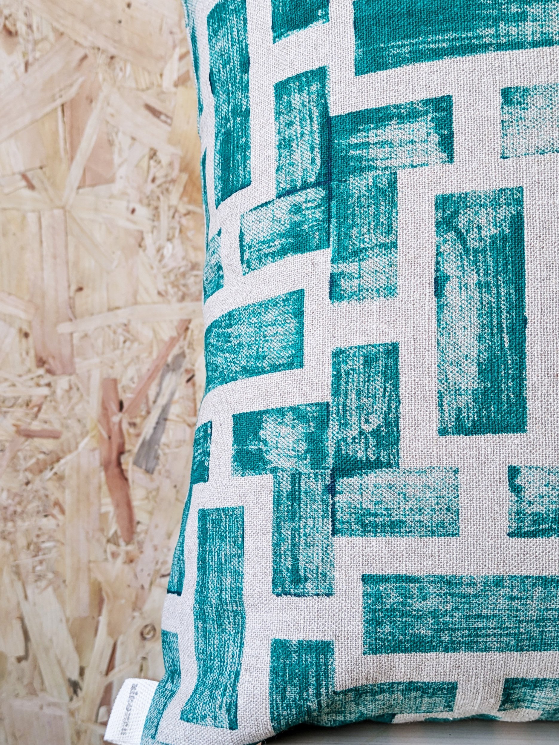 close-up detail of block printed pattern design on luxury linen cushion