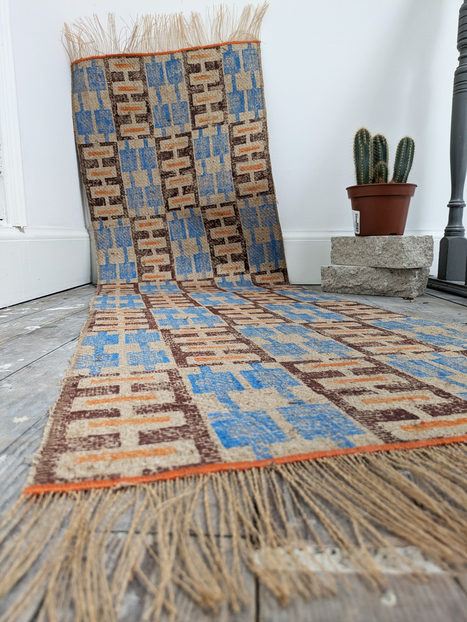 modern block printed rug with warm cosy colours and ethnic boho geometric pattern