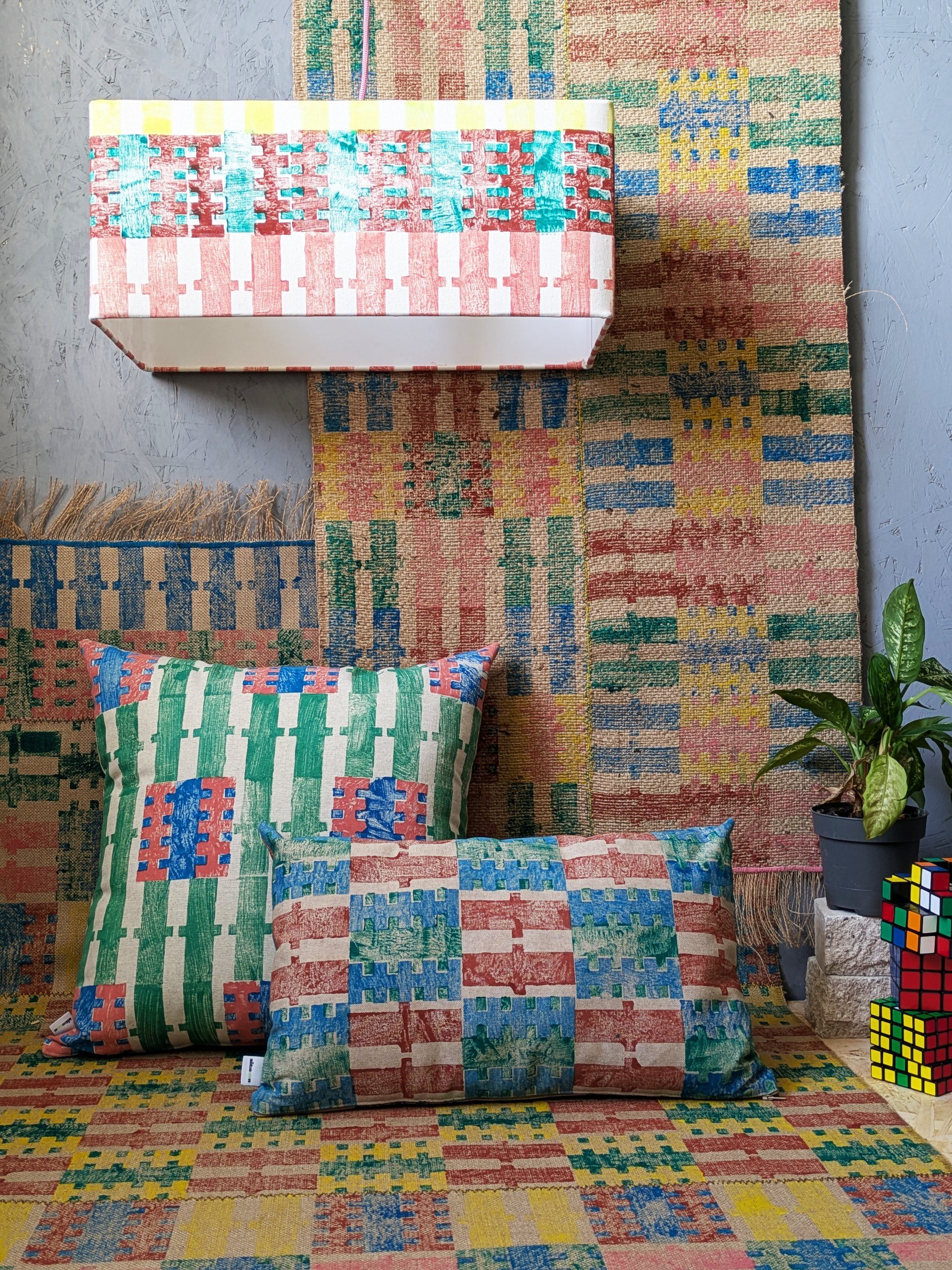 interior scene with bold, vibrant stripes and check patterns and colourful textile design in modern studio scene