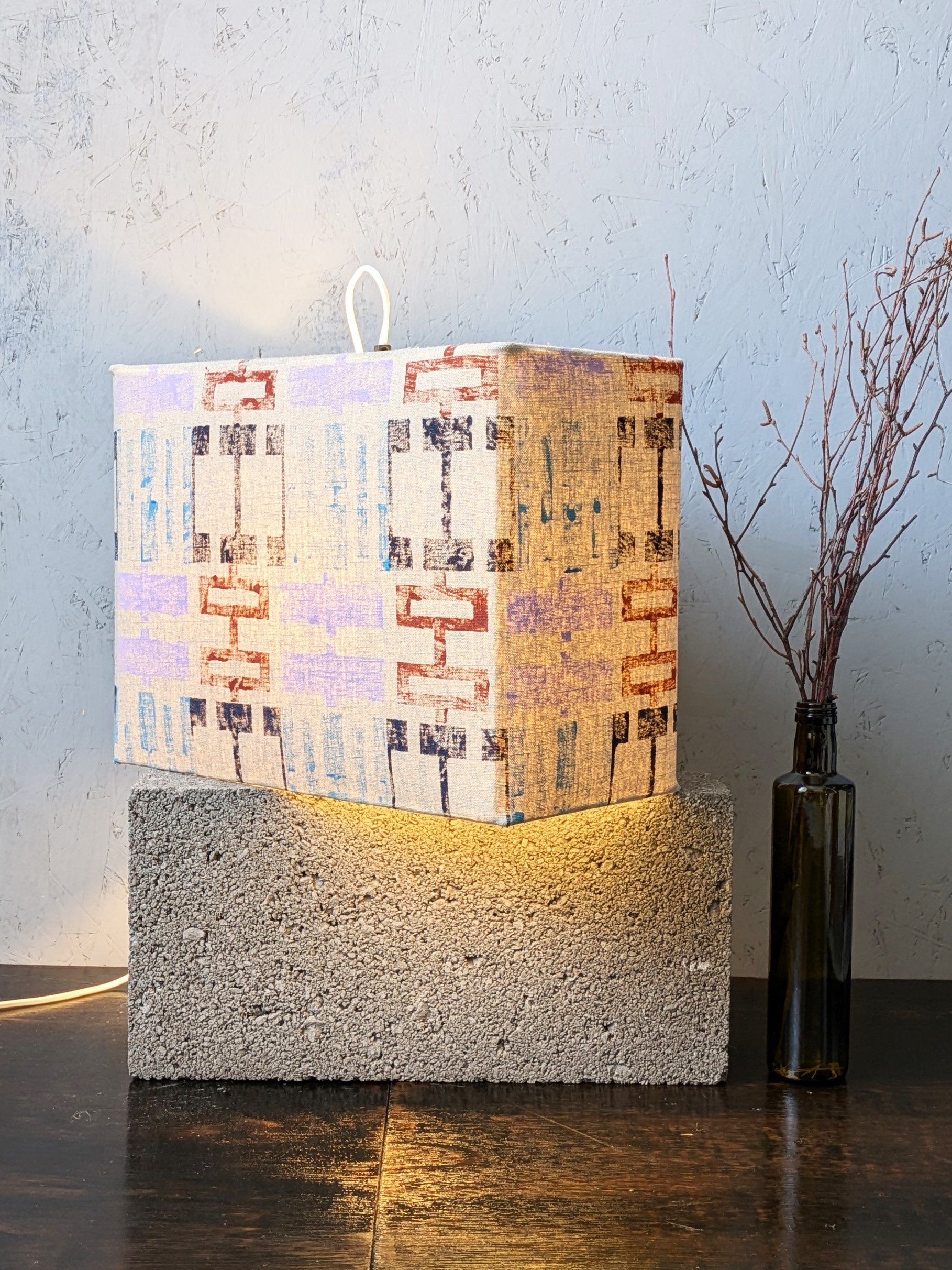cosy ambient light with brutalism inspired print design on rectangular lampshade