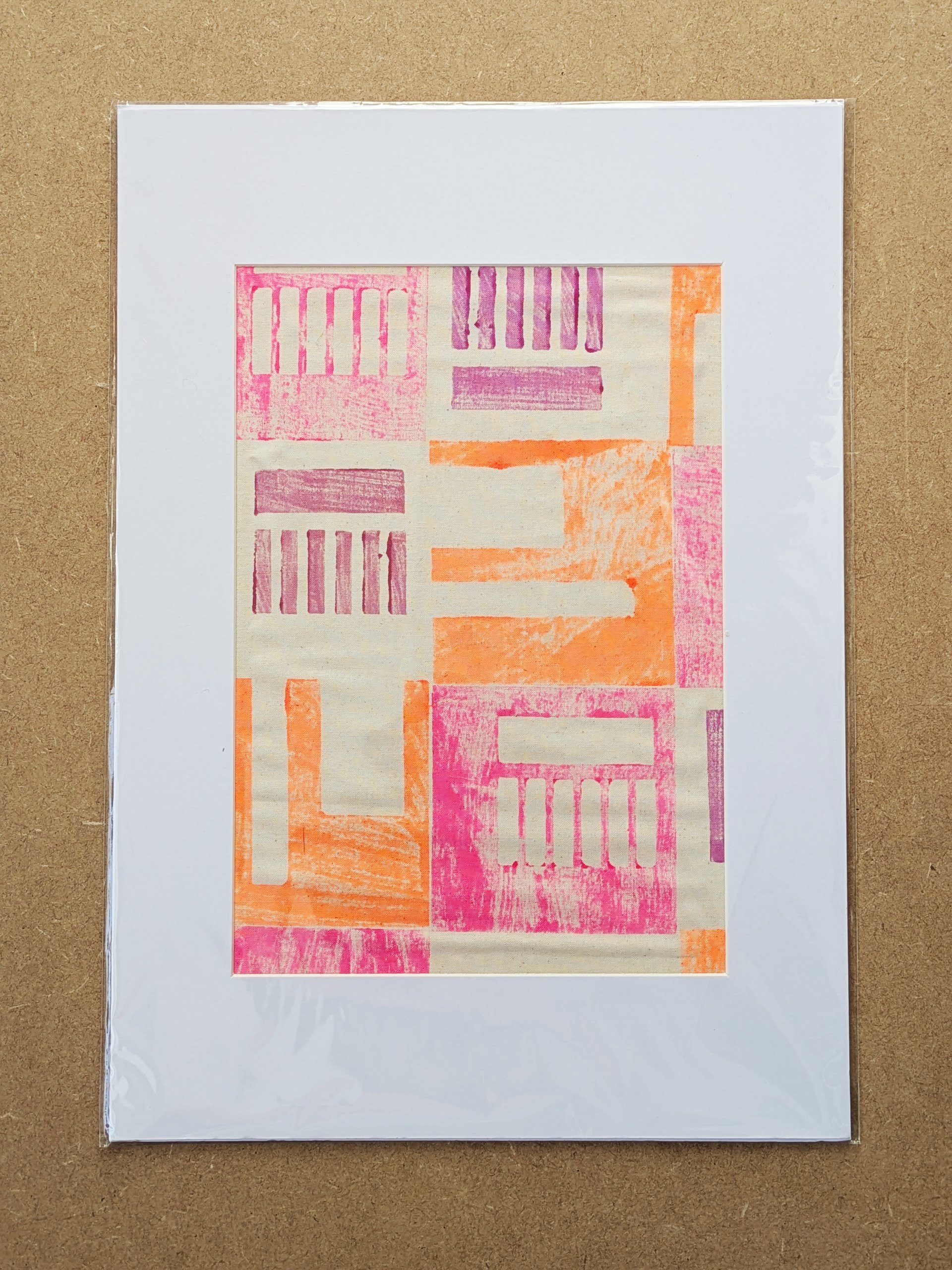 mounted A3 fabric art print with architecture inspired modern pattern in neon colours hand block-printed on cotton fabric and framed in white mountboard