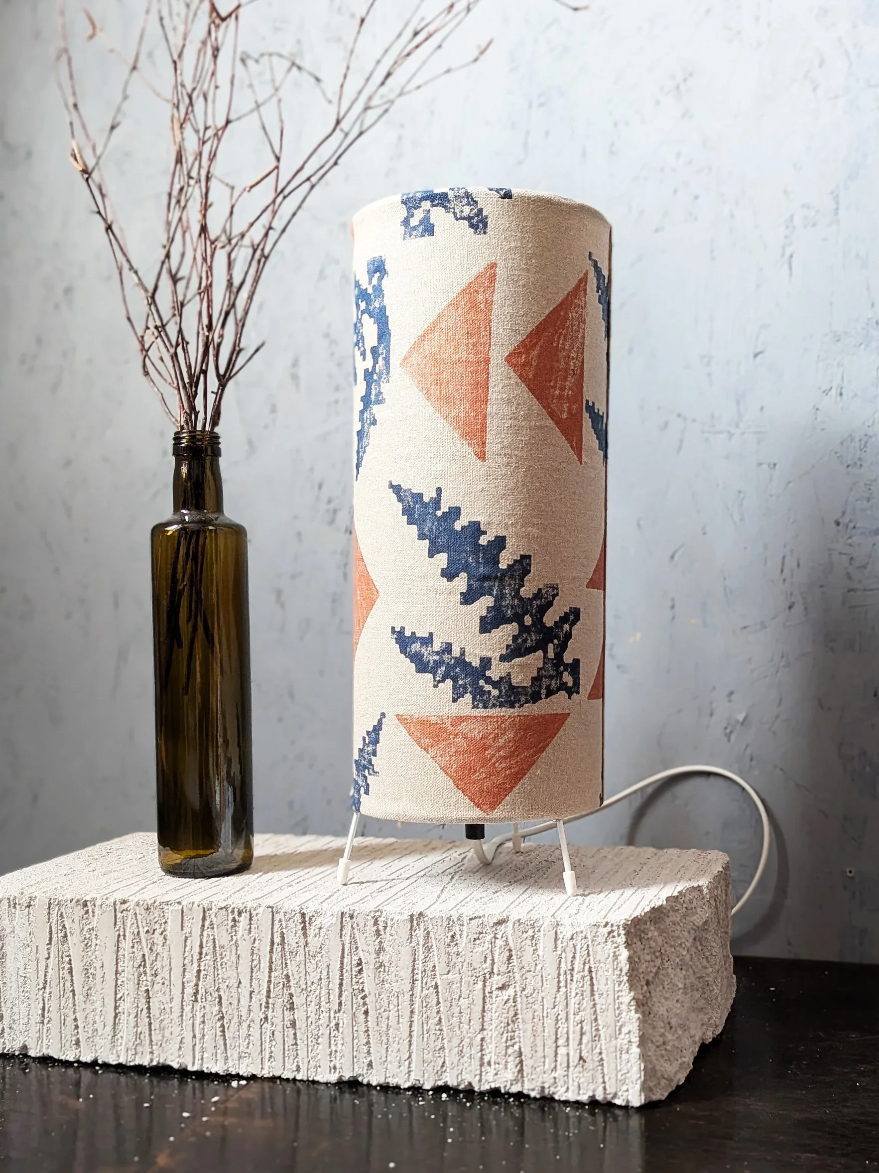modern rustic interior scene with hand printed linen table lamp