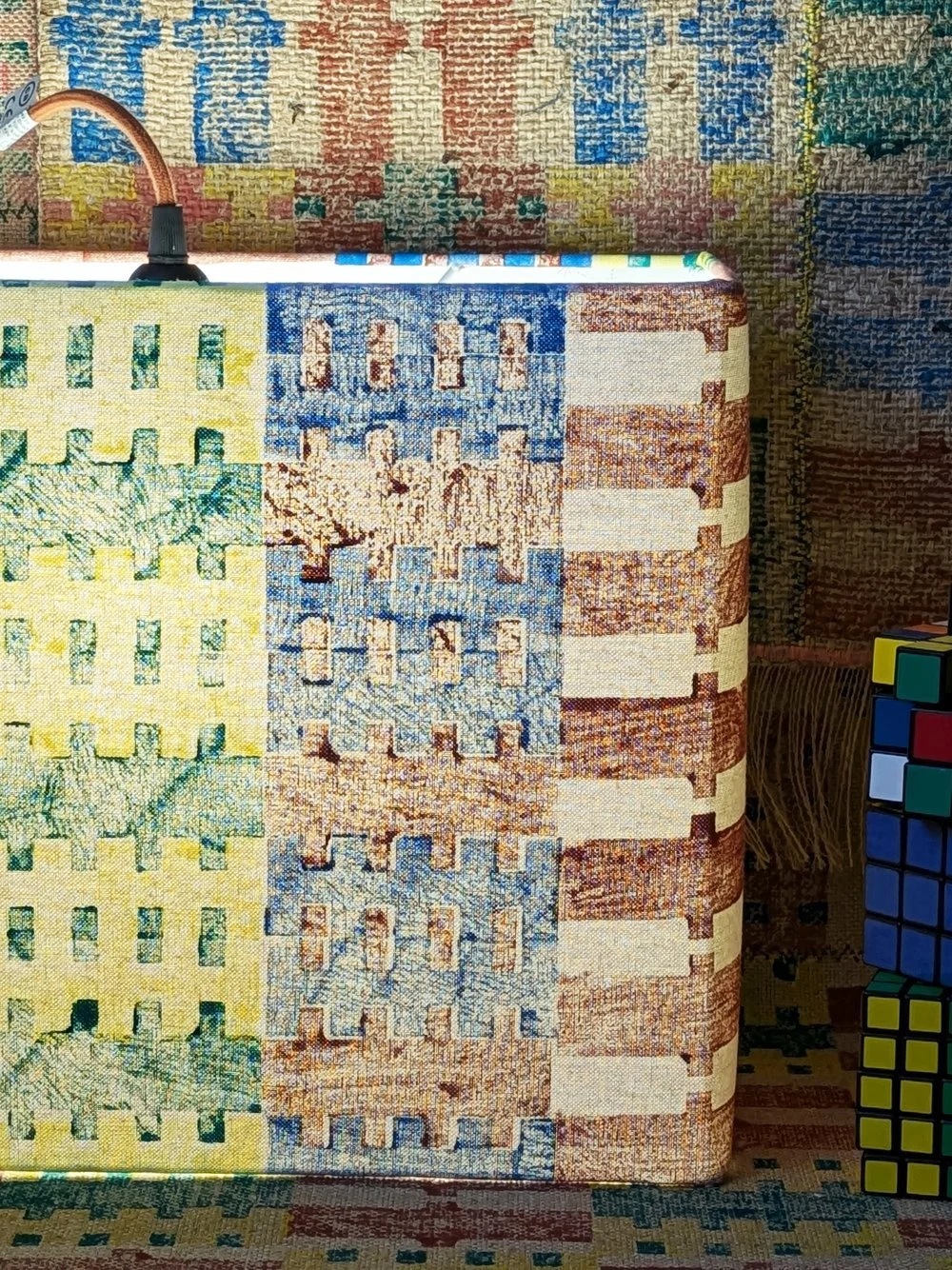 close-up detail of hand printed architectural pattern on rectangular light