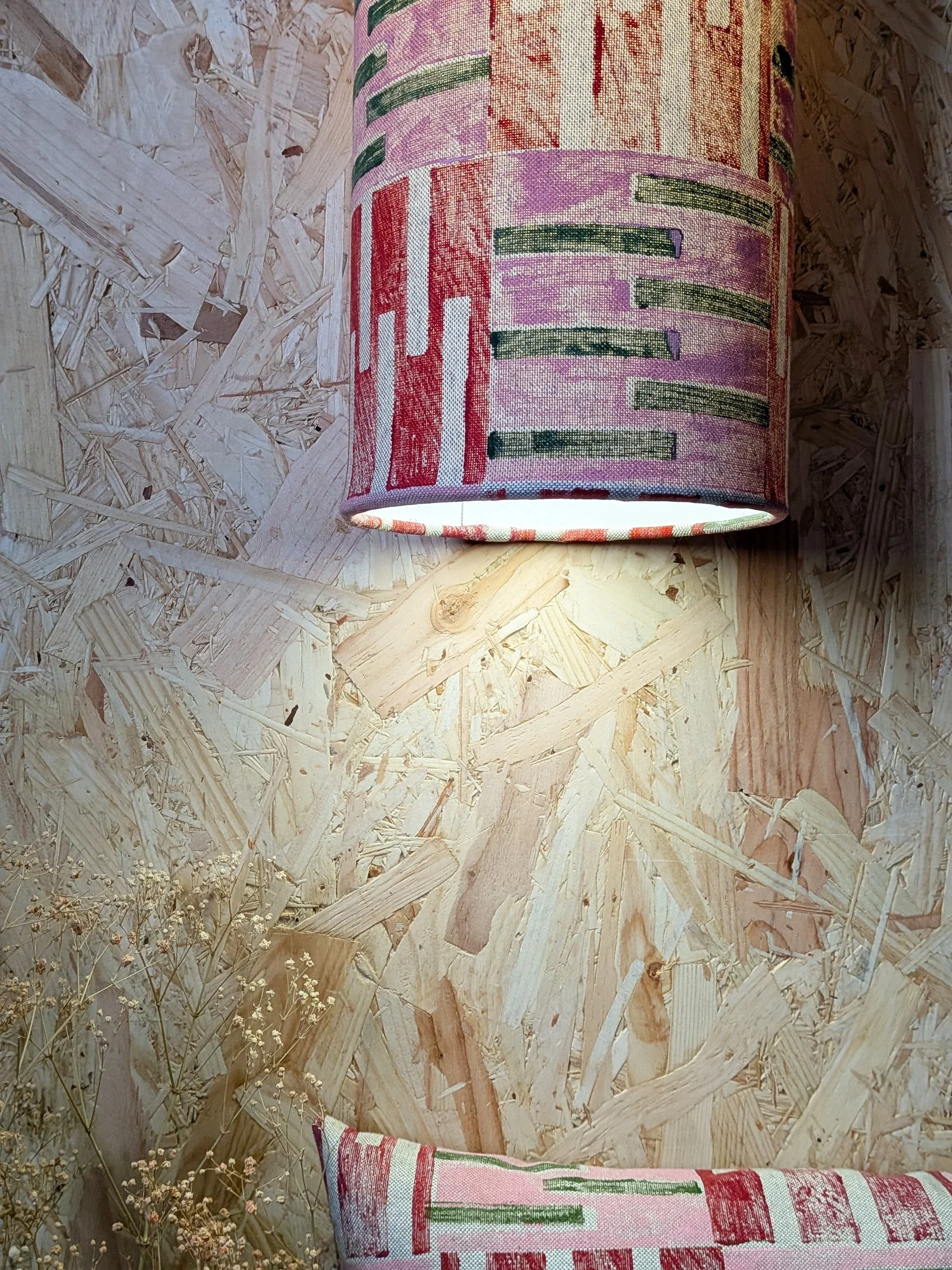 close-up detail of long hand printed lampshade in abstract geometric architecture-inspired design