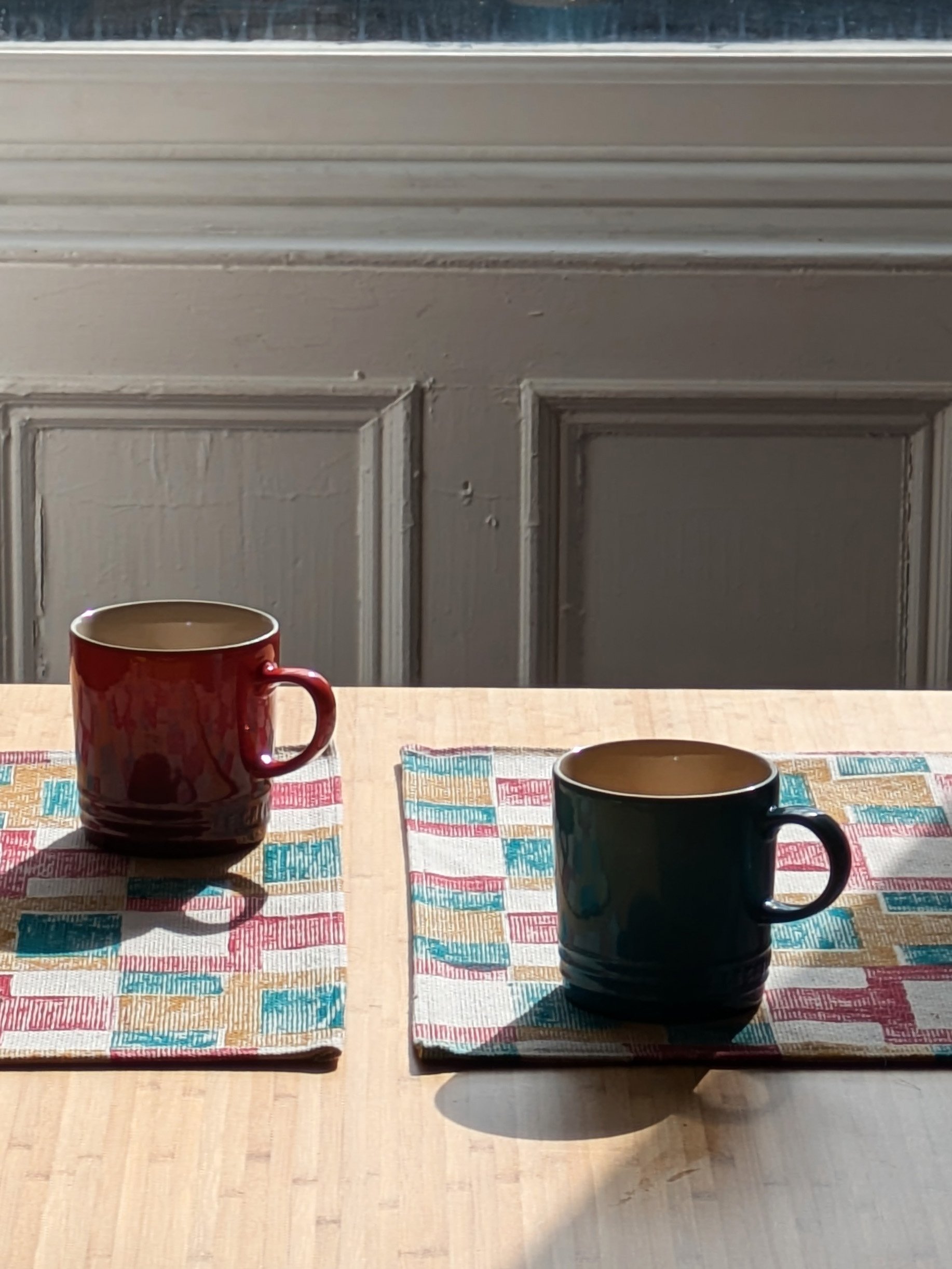 kitchen table with colourful abstract geometric place mats