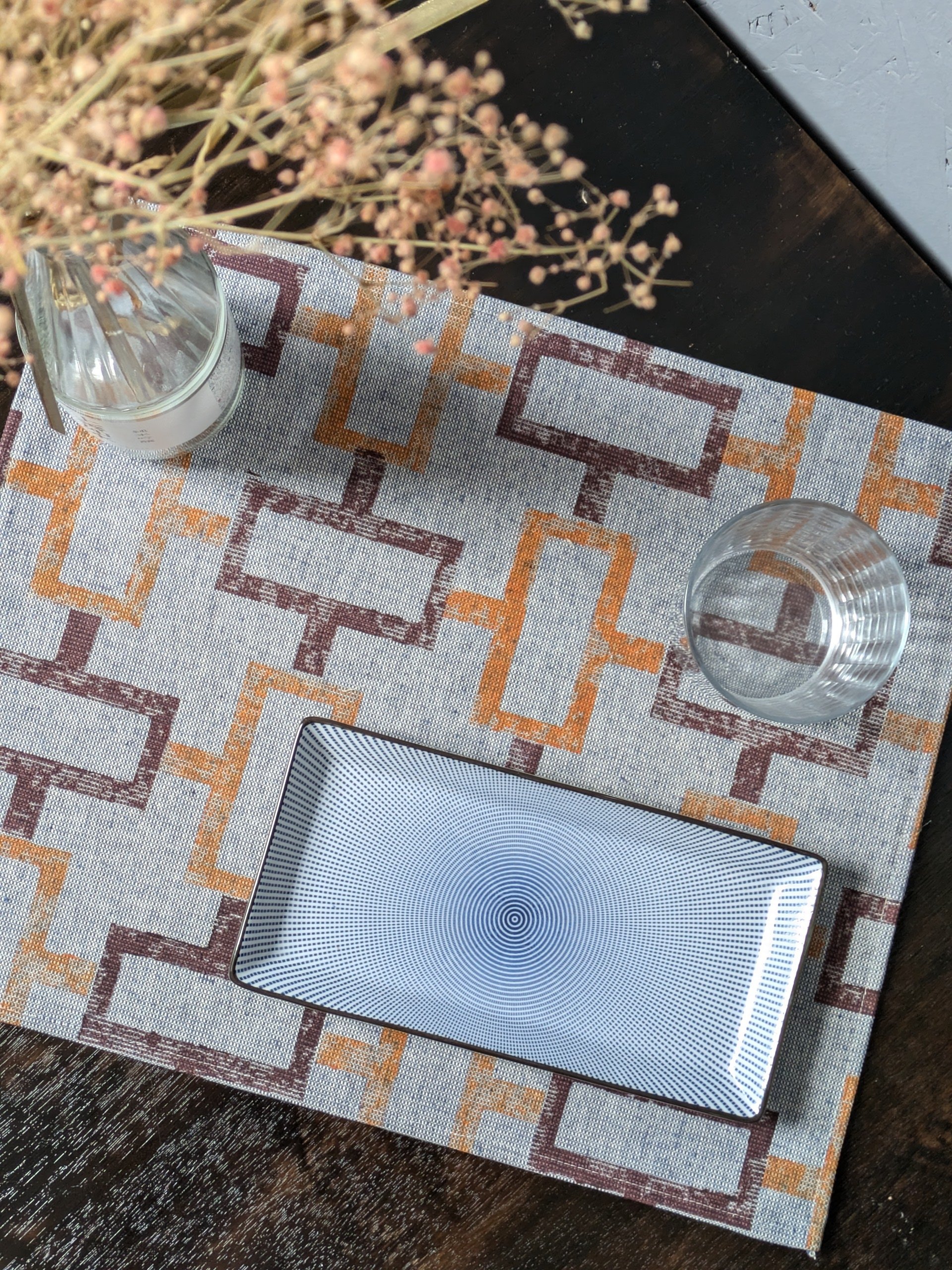 hand block printed geometric pattern design on small placemat in denim-like fabric
