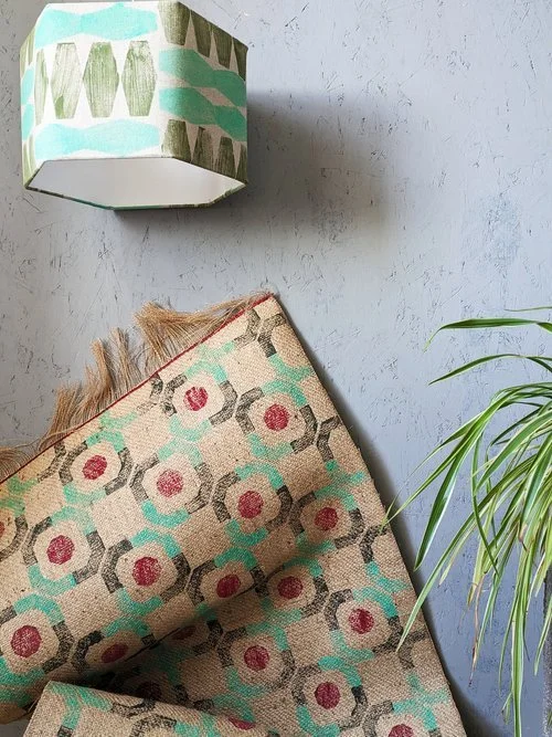 mint green lampshade and rug in modern interior decor scheme