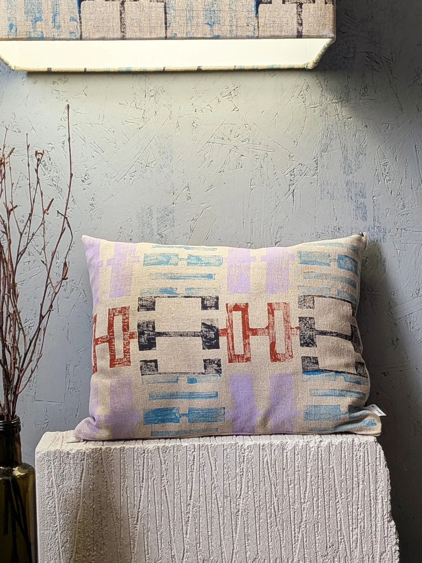 hand block printed small cushion with geometric pastel detail