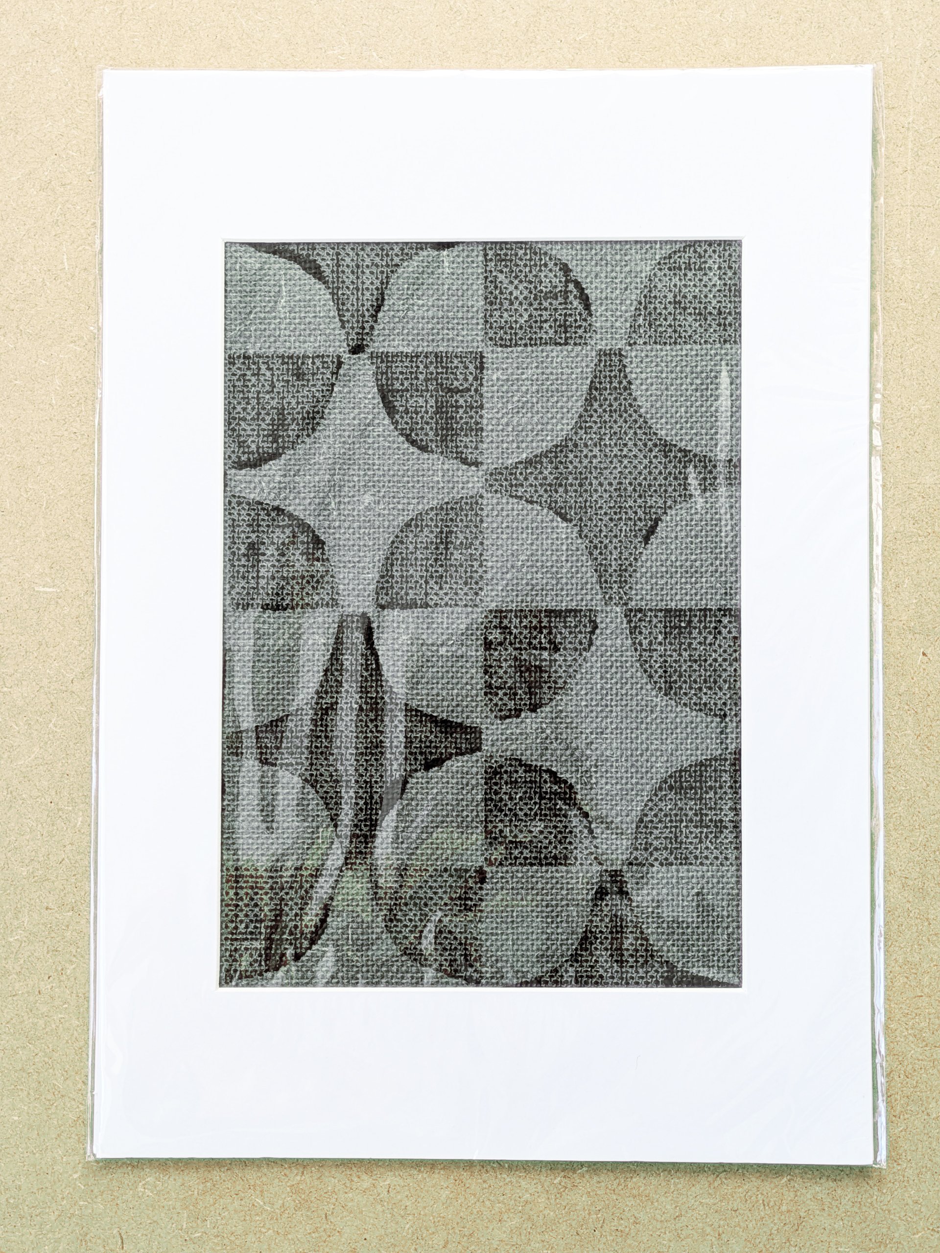 mounted A3 fabric art print featuring geometric pattern in green, hand block-printed on textured grasscloth and framed in white mountboard