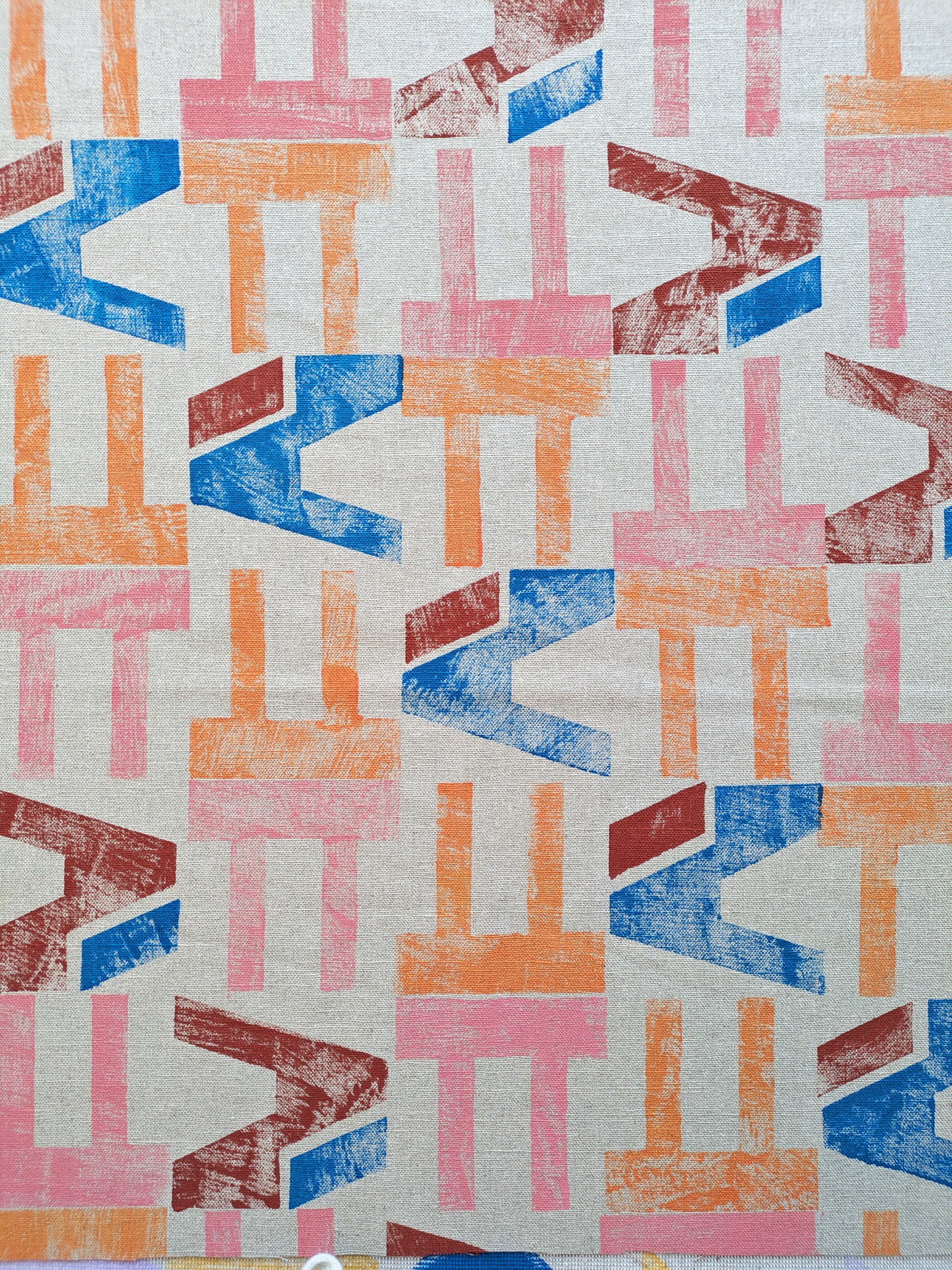 architecturally inspired modern block printed geometric pattern in dusty pastel pink and warm colours