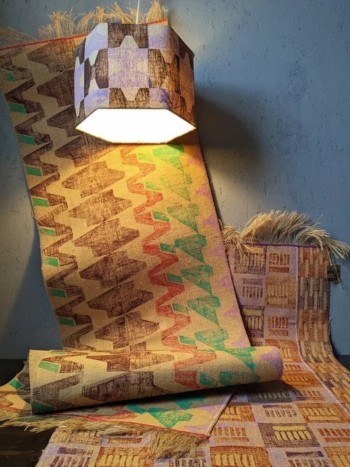 interior scene with hexagonal lampshade and jute rugs with brutalism inspired geometric prints