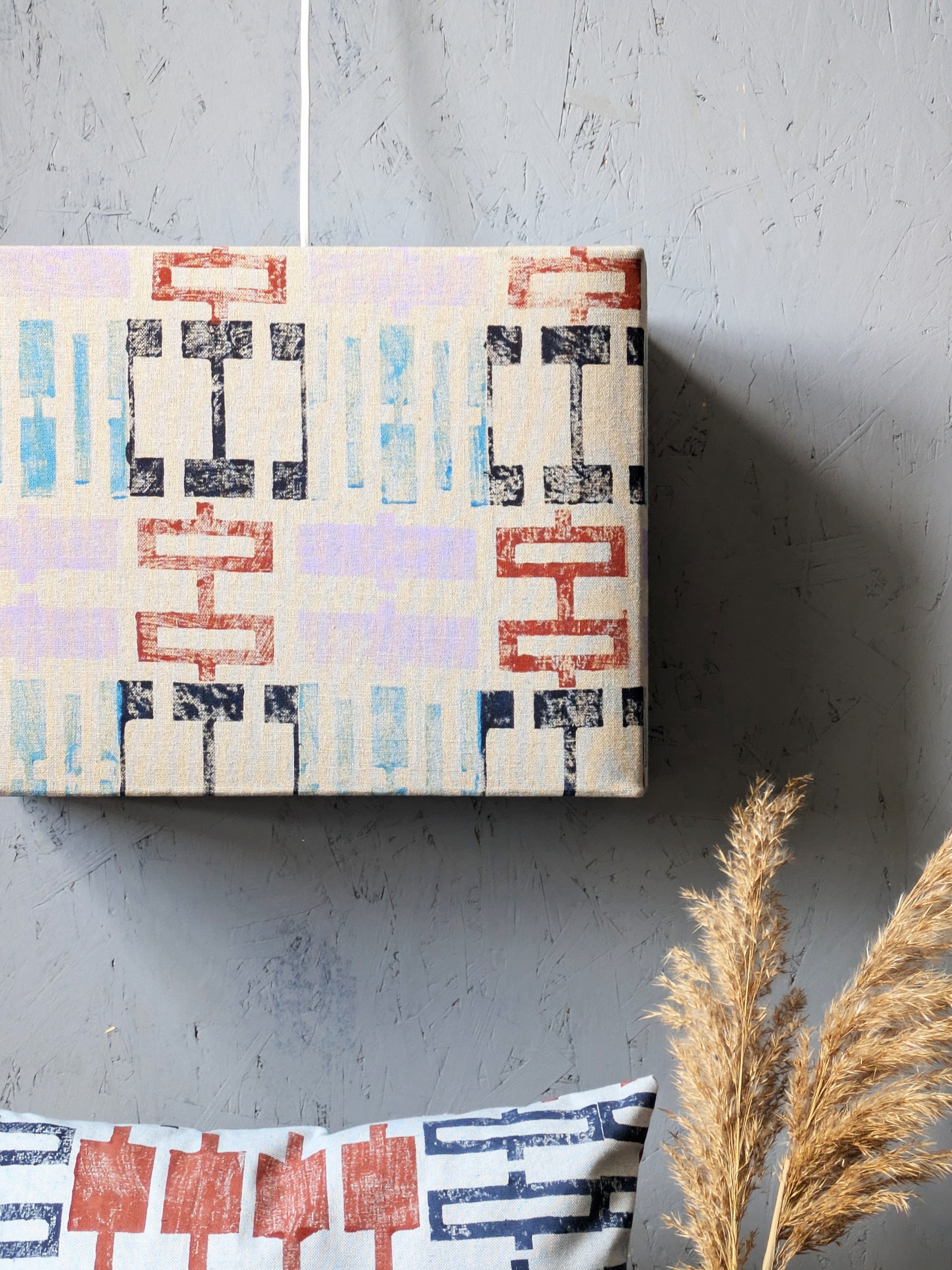 colourful earth tones on geometric architectural lampshade