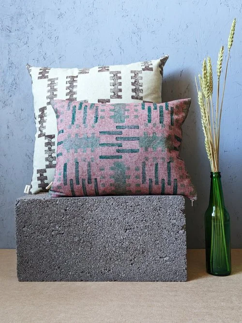cushions with geometric brick-like patterns inspired by architecture