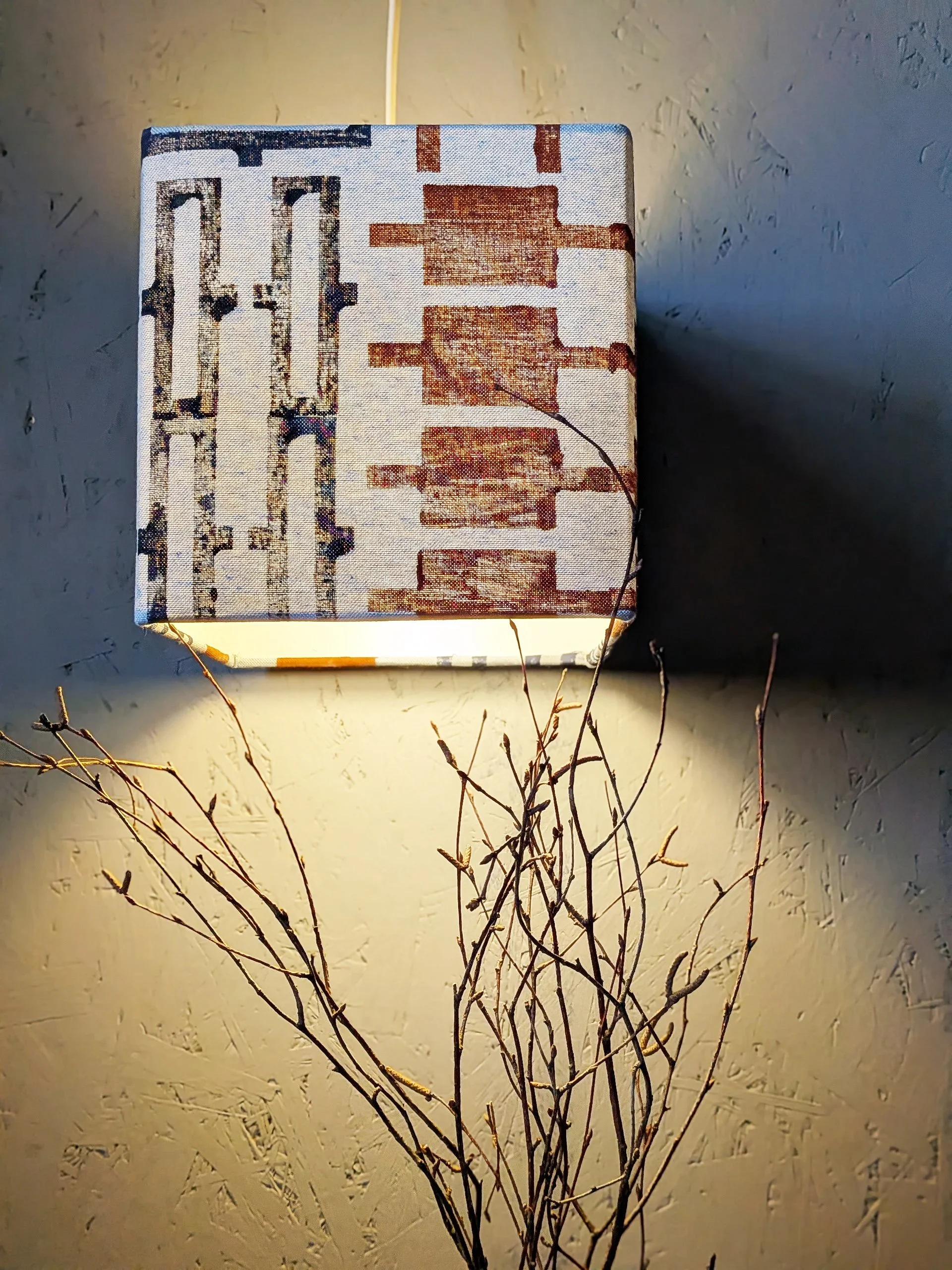 brutalism inspired cube-shaped lampshade in blue hand block printed detail