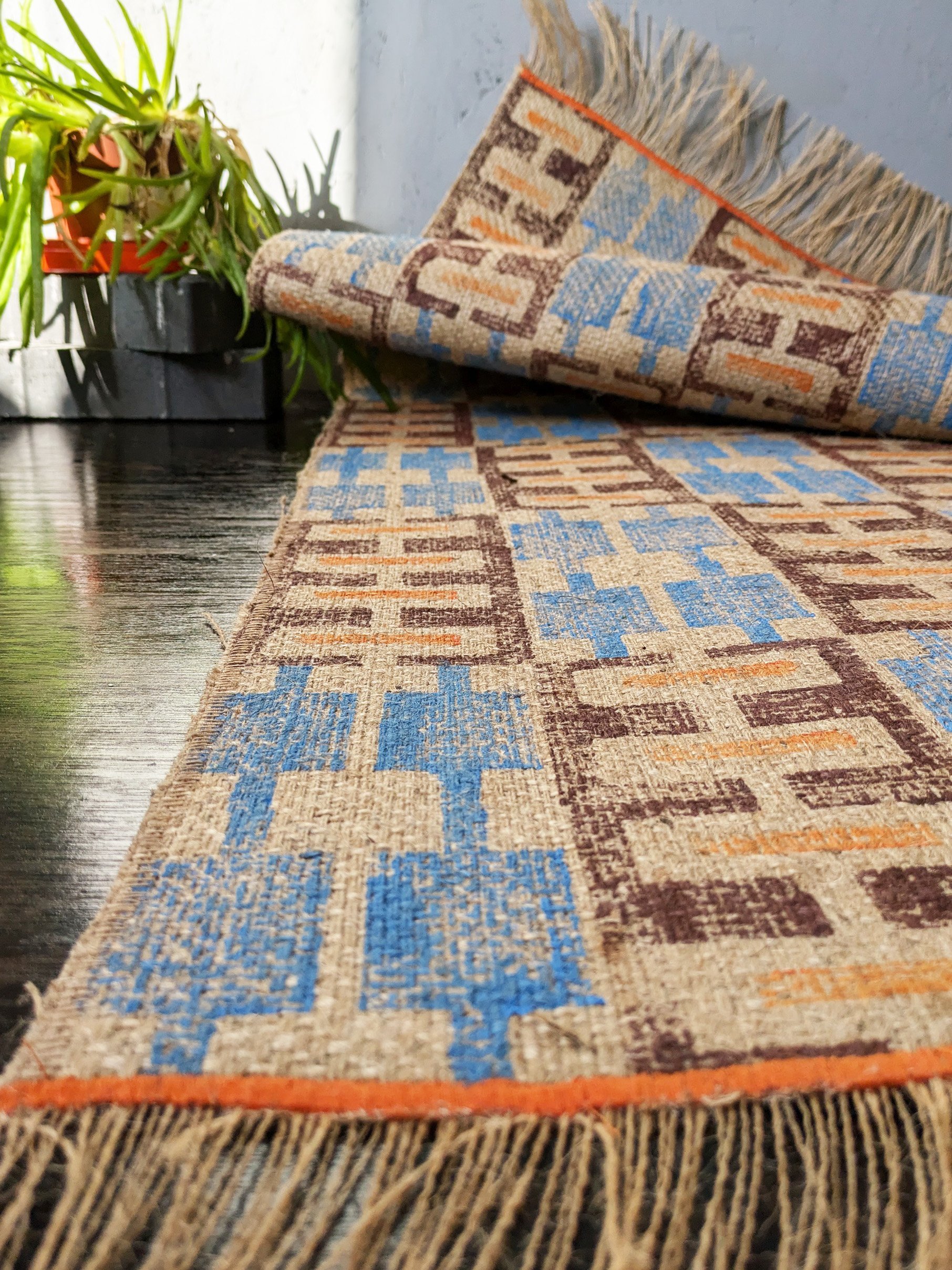 warm cosy interior floor decor with geometric block printed rug in ethnic boho pattern