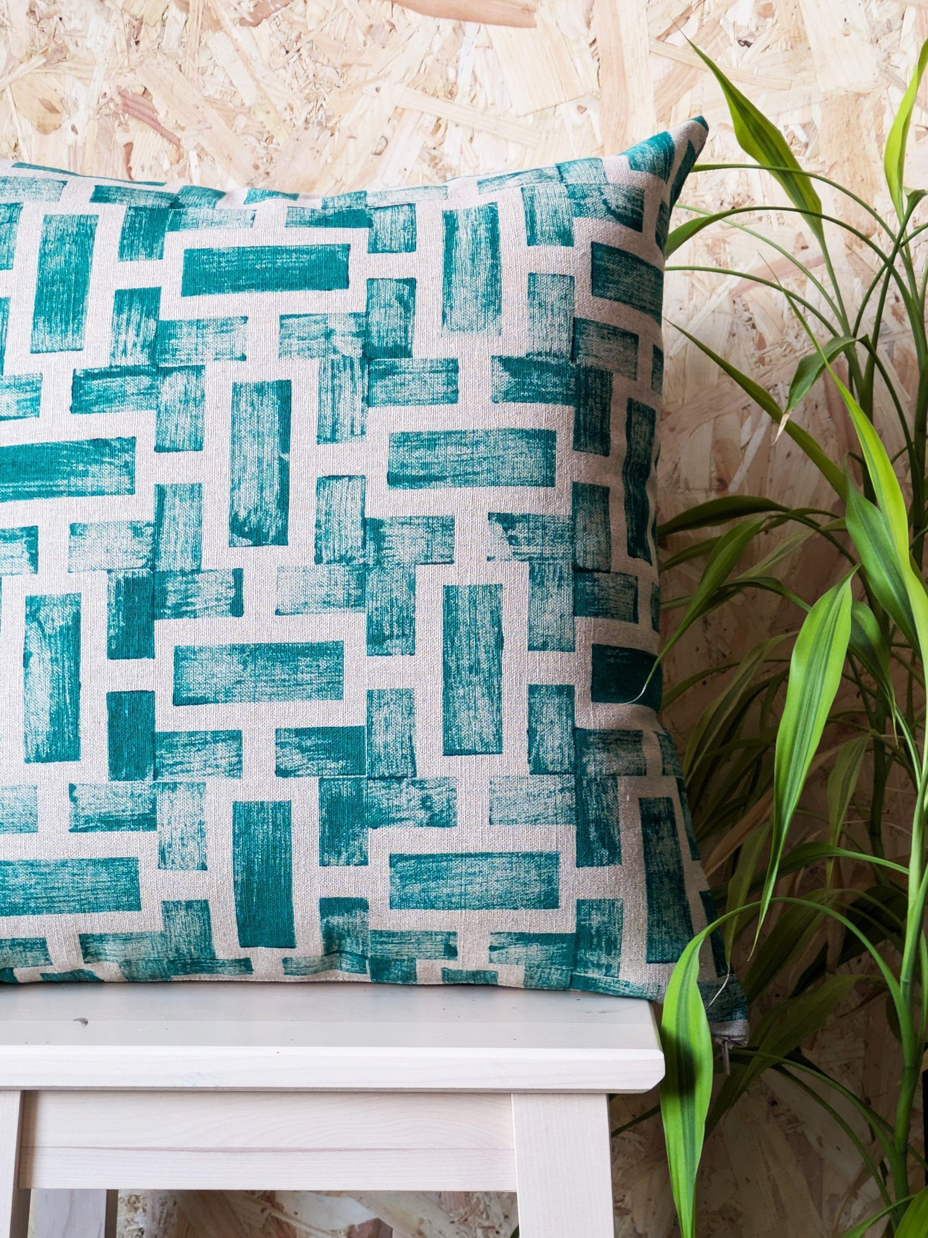contemporary luxury cushion with dark green abstract geometric architectural inspired print