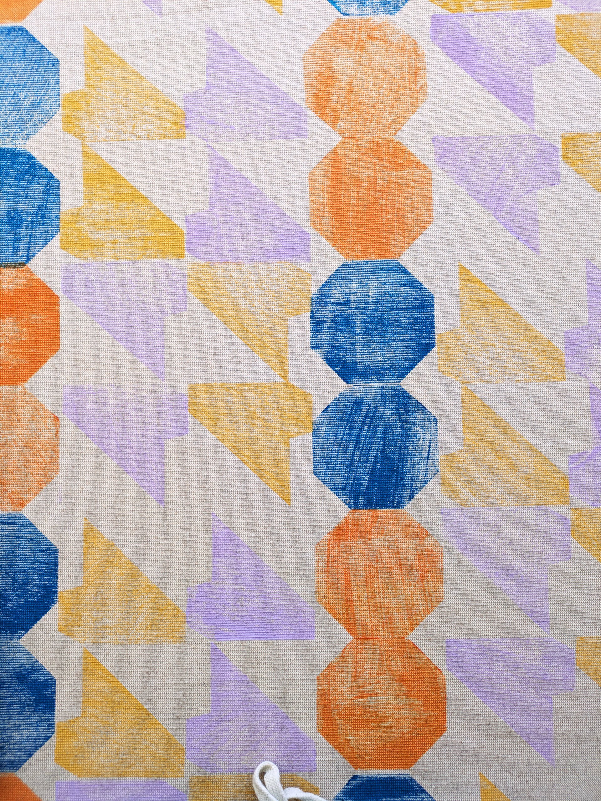 geometric printed pattern with angular motifs in soft pastel lilac and mustard colours and abstract design for interior textiles