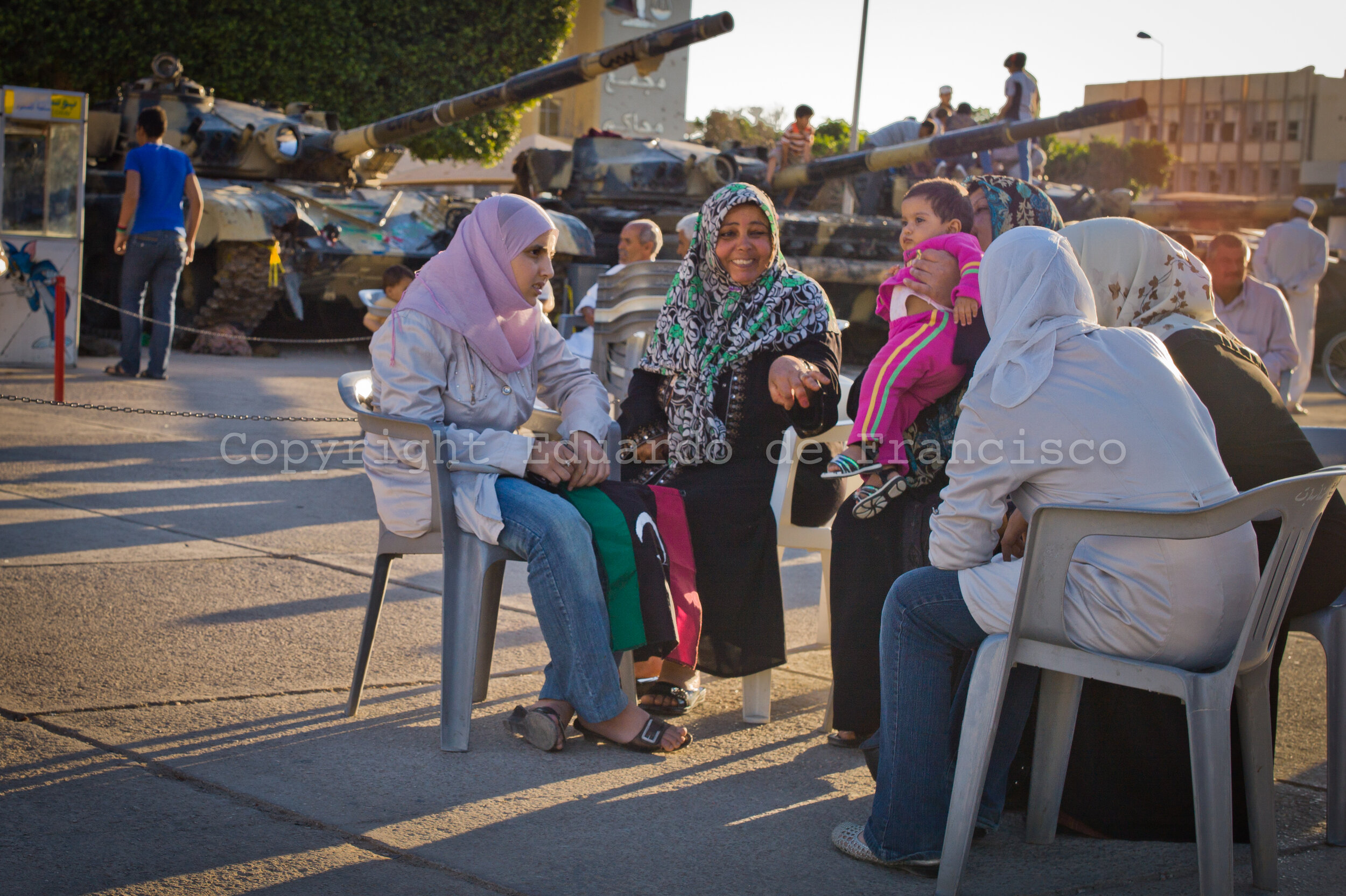  At dusk, a group of women chat in Sahat Al Hout Square 