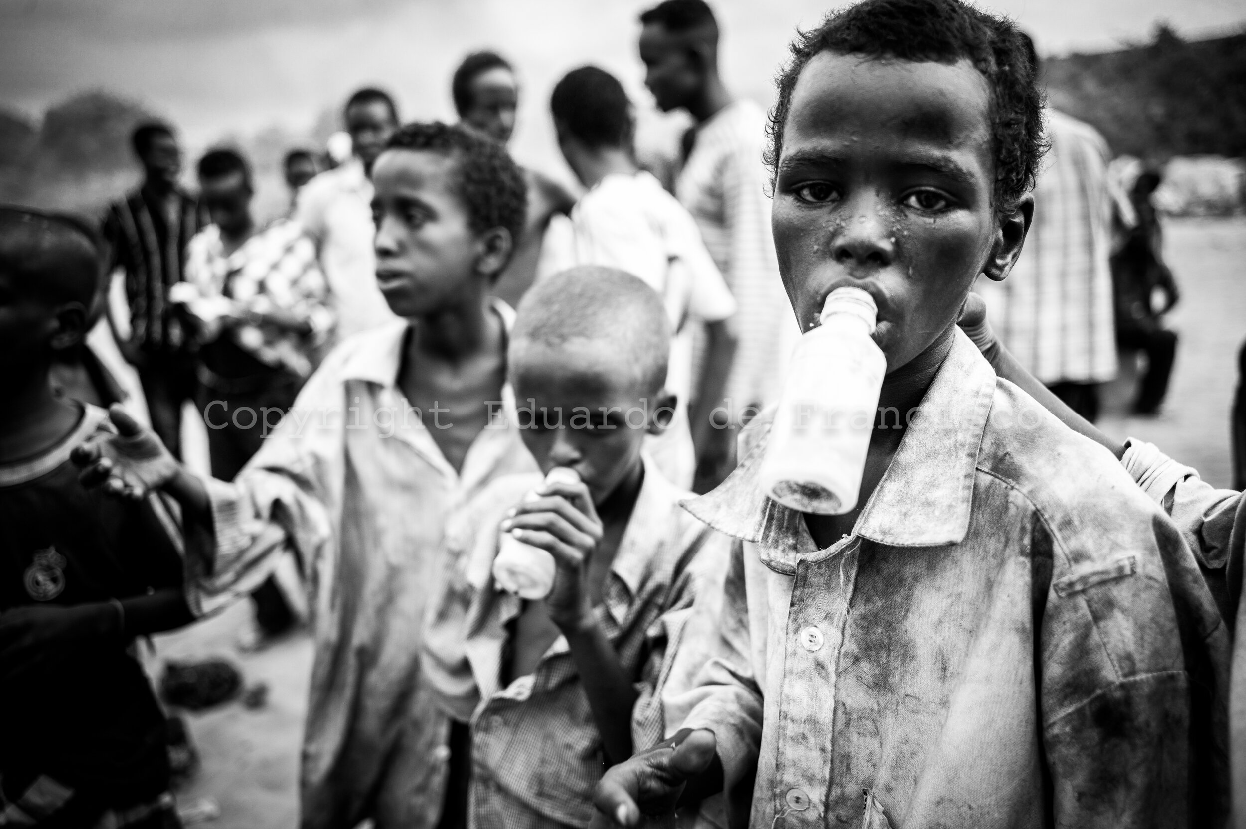  Street children in Mogadishu sniffing glue, bought to older children with the money that they get begging. To feed themselves, they scavenge in rubbish dumps. Heavy glue users like them can expect to suffer irreversible brain damage in two years. --