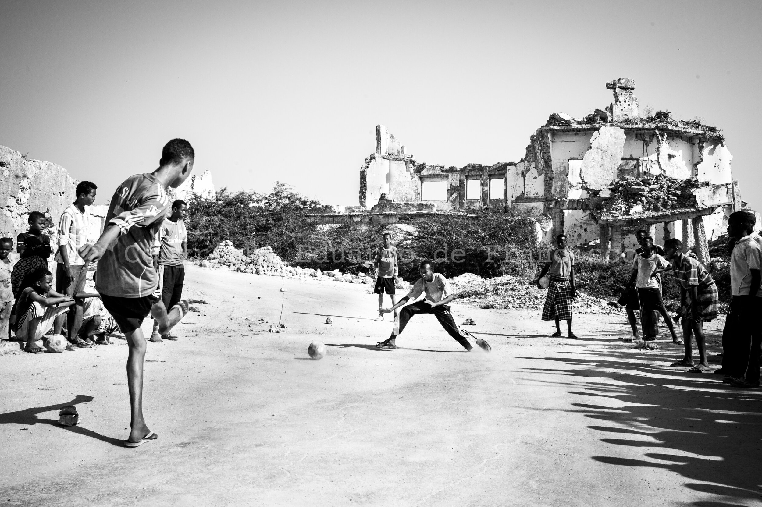  Boys playing football in the streets of Mogadishu. 