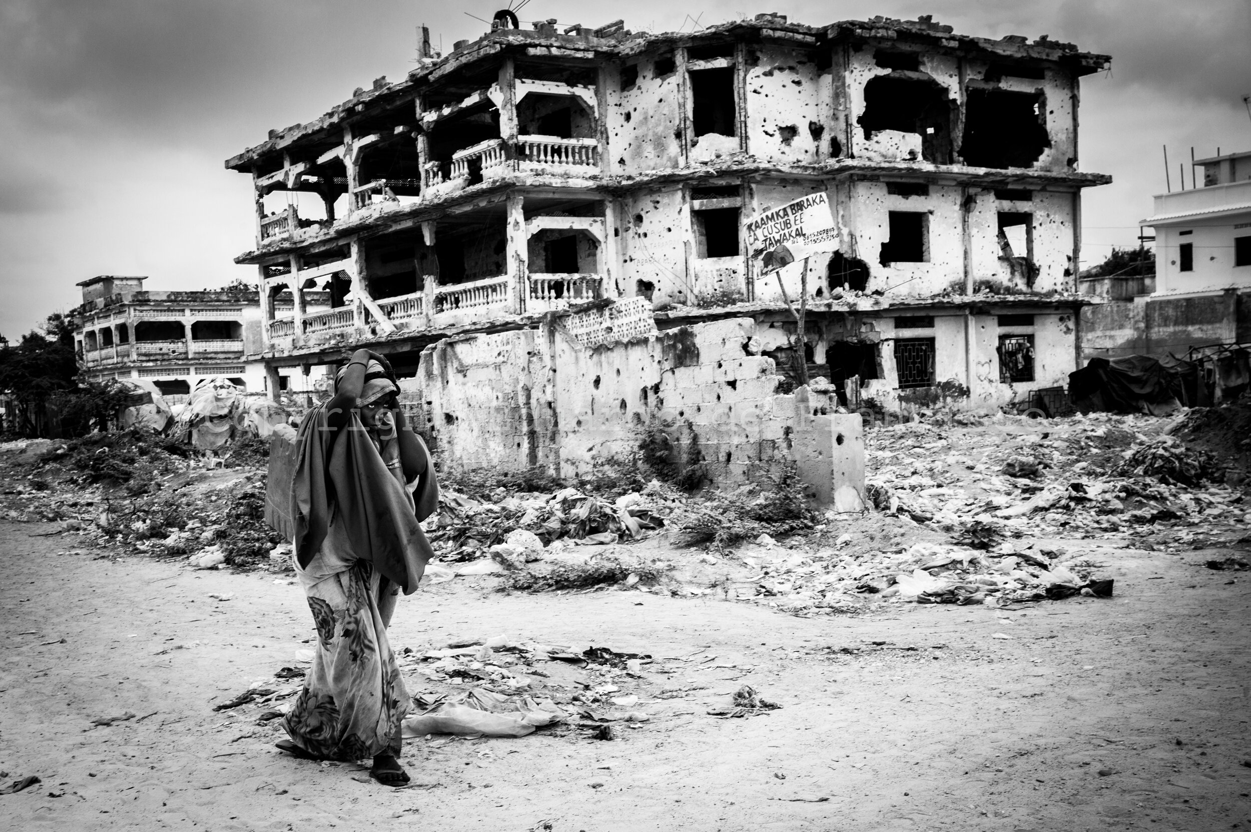  Scene near the Bakaara Market in Mogadishu, a city where no building is untouched by the ravages of the war, and most of them have been extensively damaged 