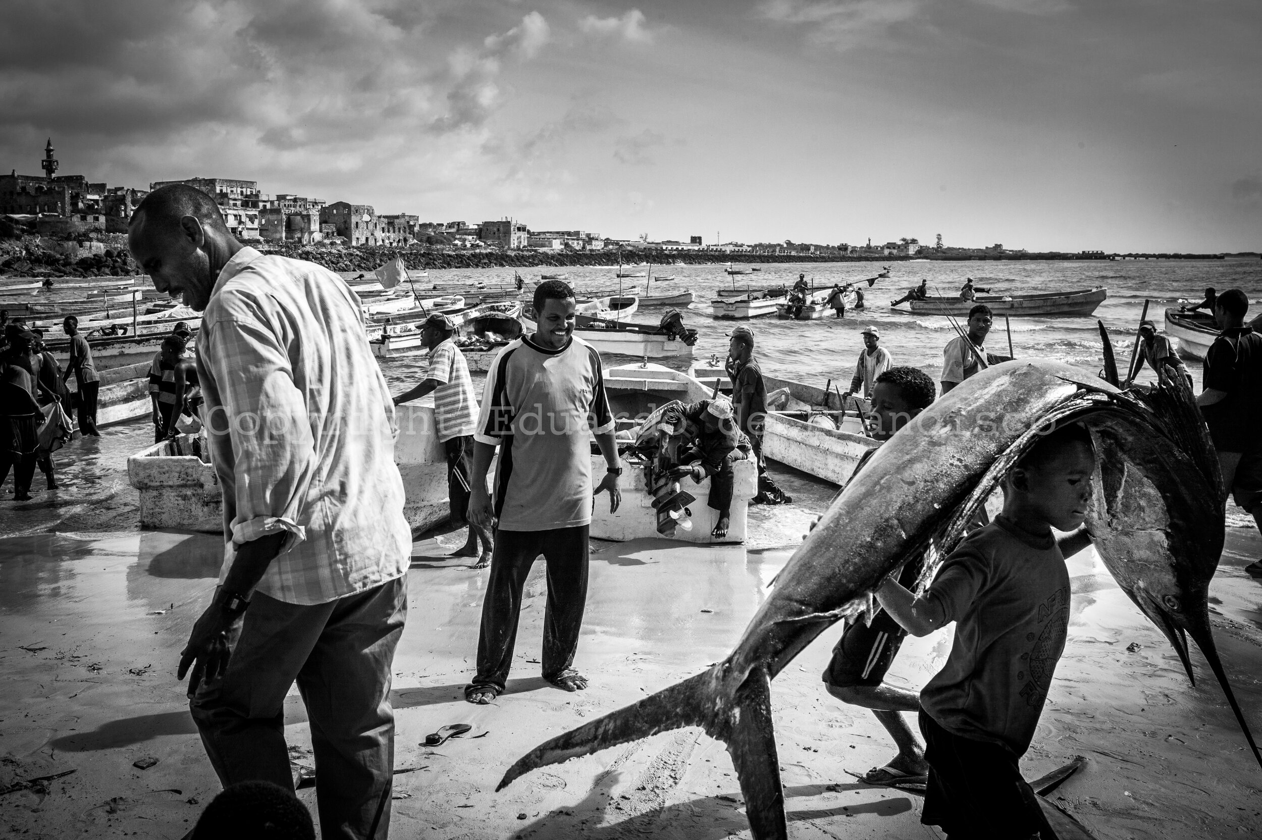  Scene at the Mogadishu fishing port, a small beach near the city centre. As with every other industry or task, hundreds of children are used as cheap labor. 