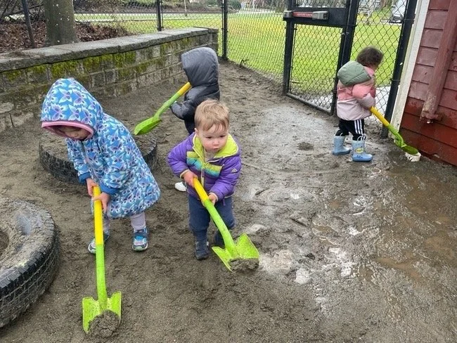 toddler yearbook digging outside.jpeg