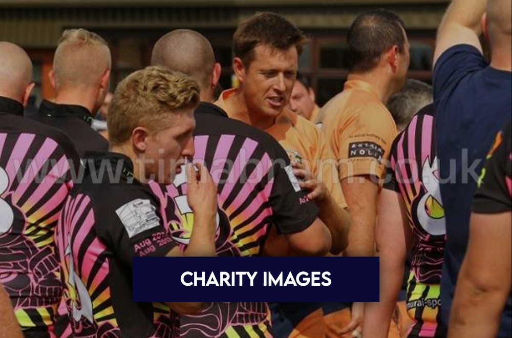 Aldwinians players at a charity event in matching pink and black jerseys
