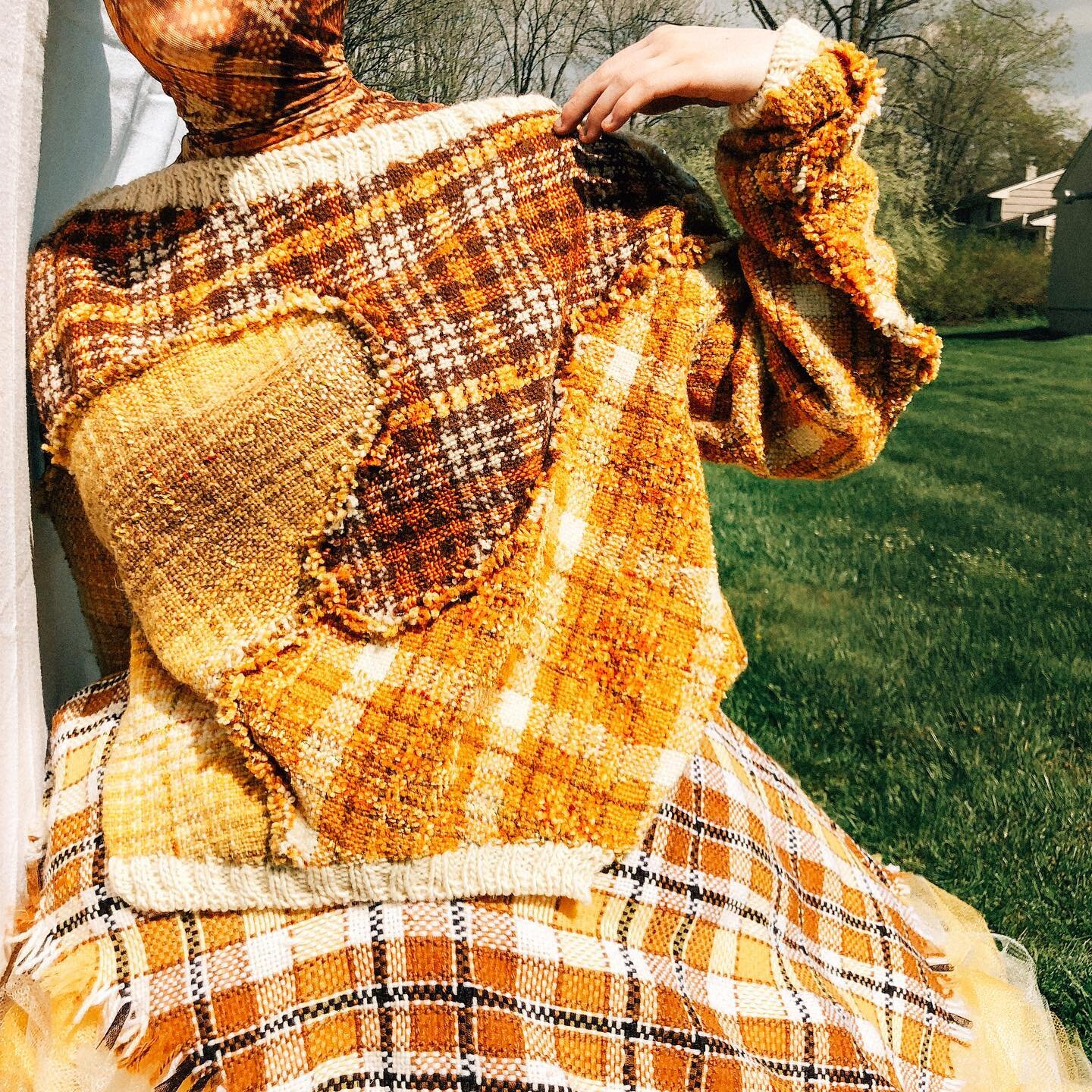 Final look from my thesis collection: handwoven sweater and big tulle skirt!  The patchwork pattern in the sweater is in the shape of the rivers surrounding my hometown 🗺 My experience growing up in Kansas City has irrevocably shaped my perspective 