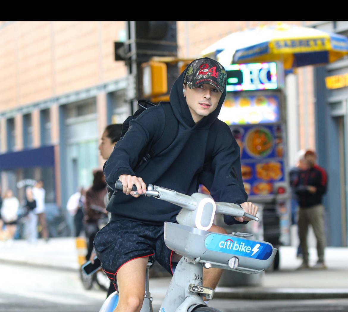 Chalamet riding around our block 