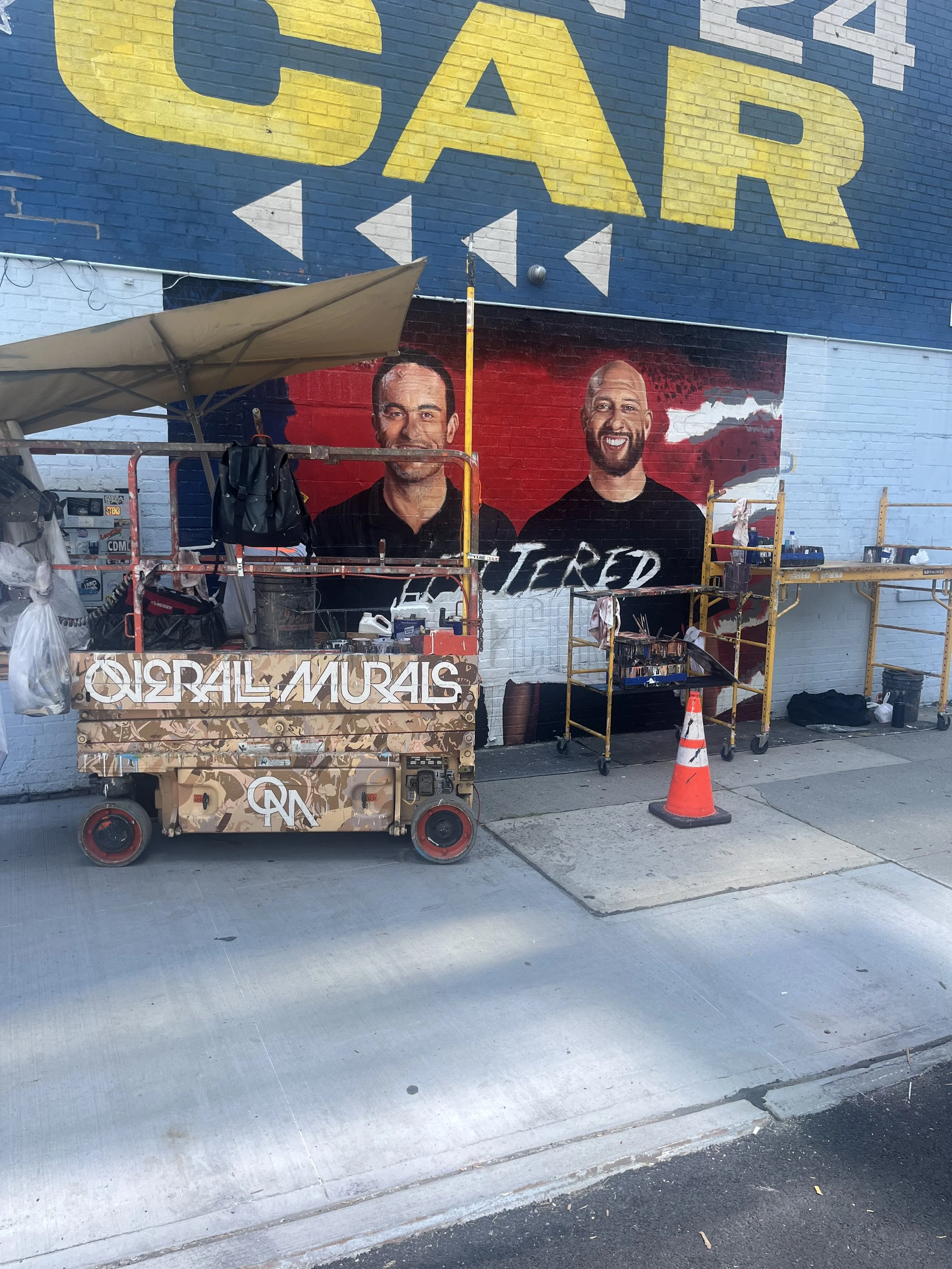 Landon Donovan and Tim Howard mural getting painted on 24th Street and 10th Avenue 