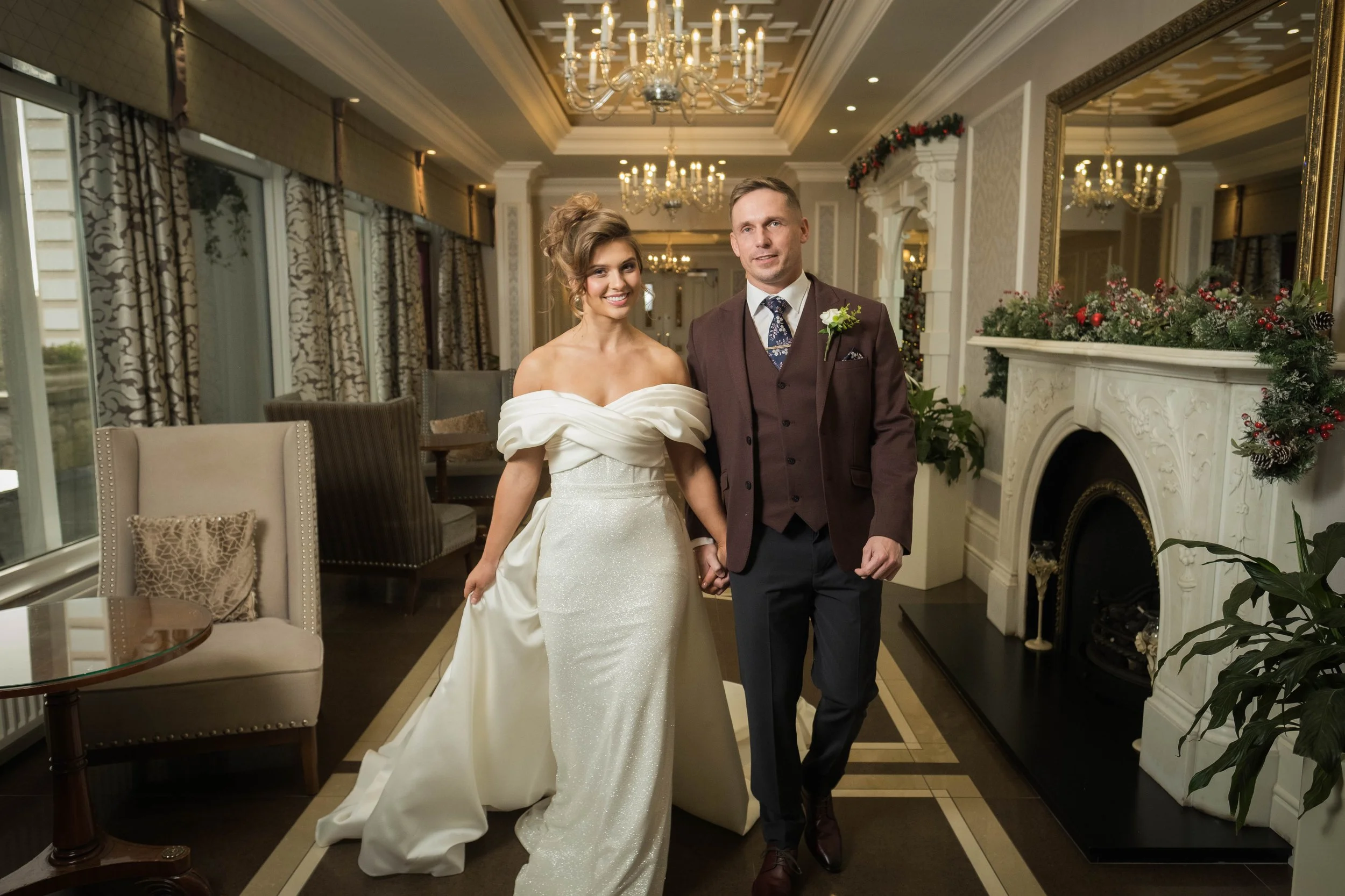 Bride and Groom walking down a beautiful hallway