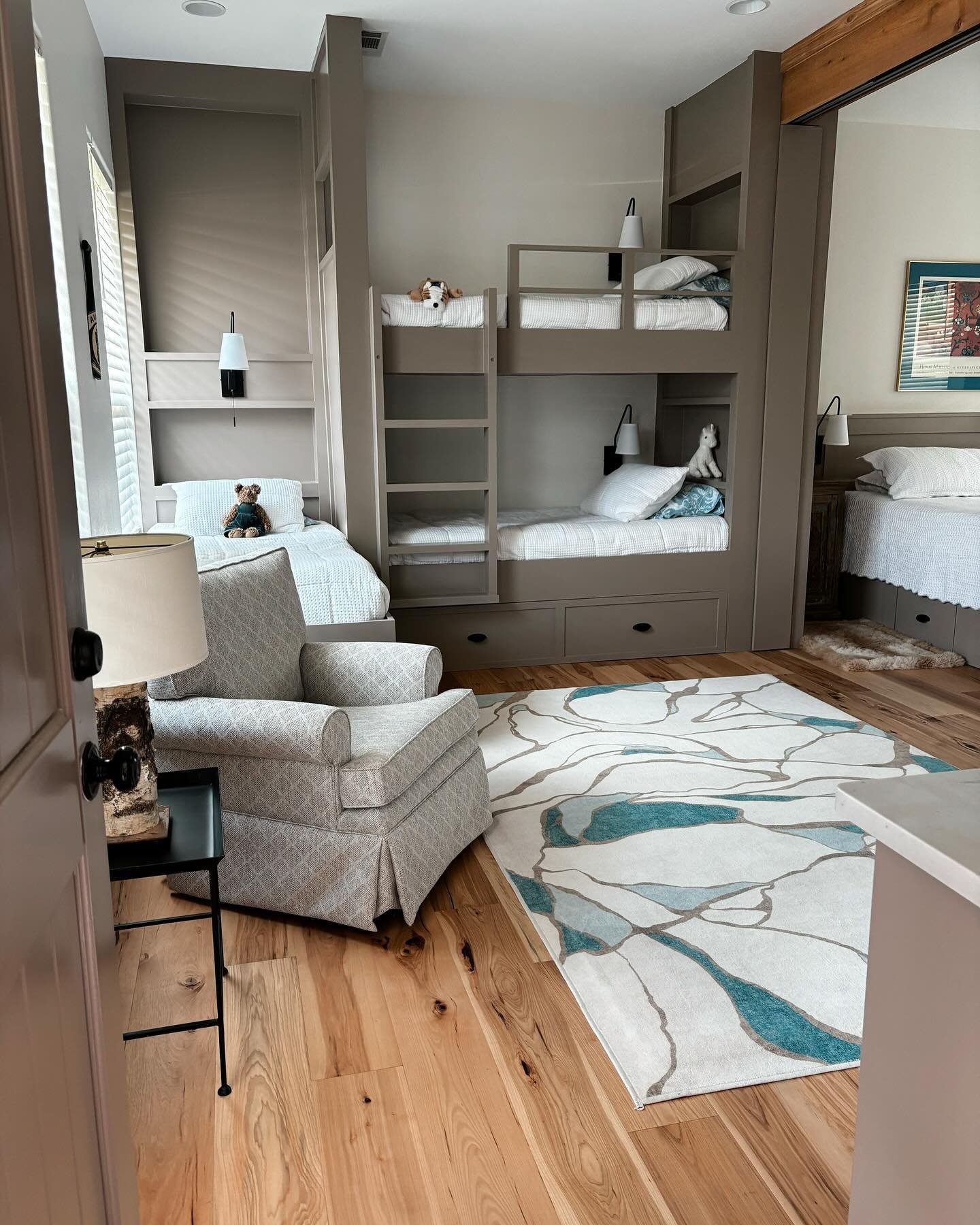 Part 1 of this Lake LBJ bunkhouse remodel 🐡⛵️🦆What started as a dated garage apartment is now a playful bunkhouse that sleeps 6. The custom built-in beds include drawers underneath for added storage, a trundle bed, lamps, outlets and shelves by eac