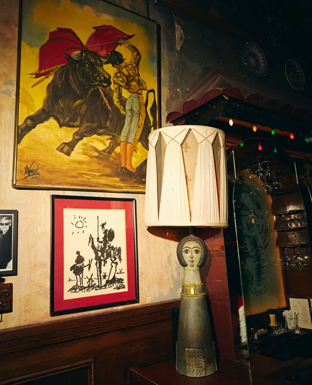 NYC restaurant El Quijote showing historic ceiling, booth seating, four tops, and vintage french chandelier pendant lights. Hospitality interior design and consultancy by Studio Sio, New Zealand