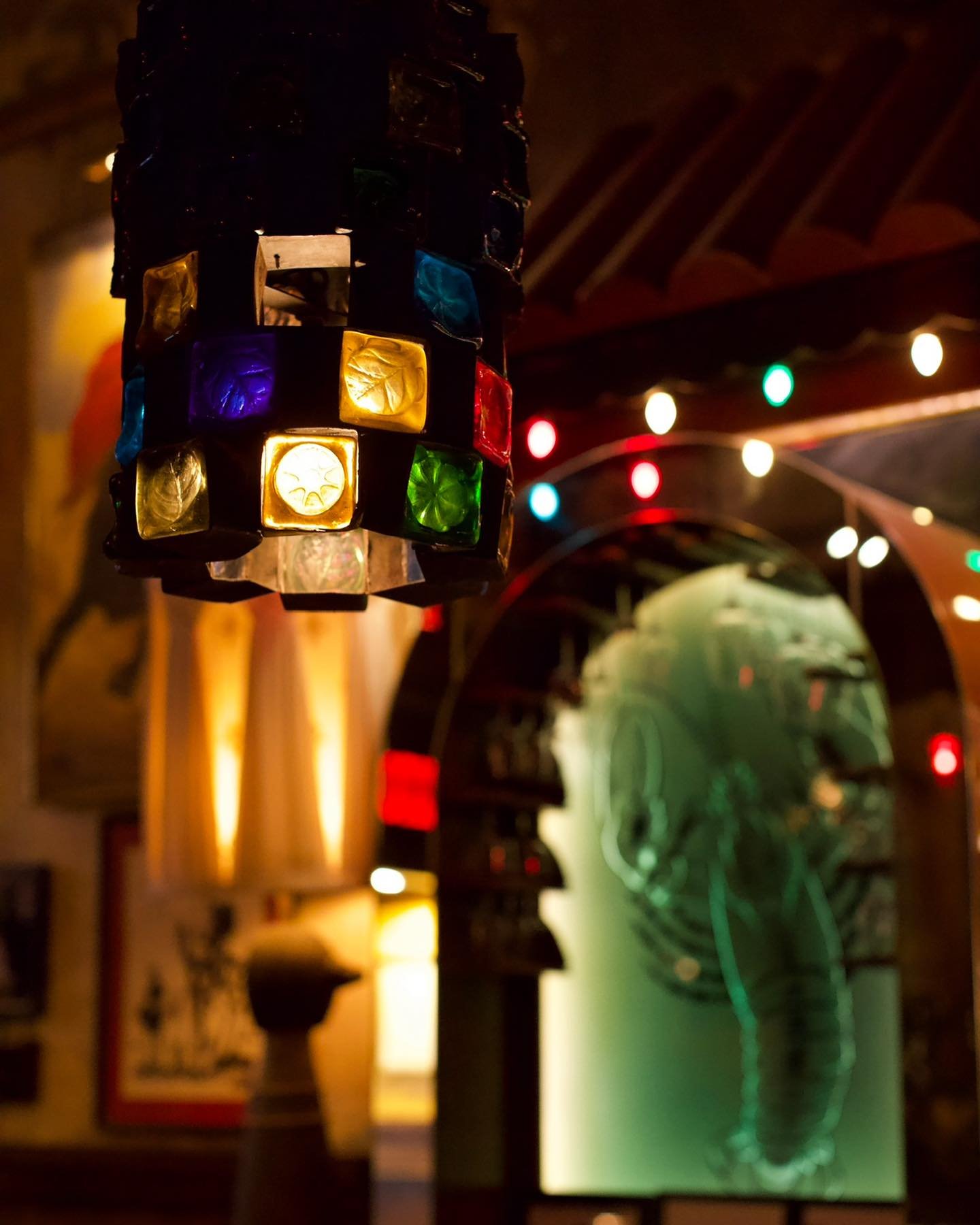 NYC restaurant El Quijote showing historic ceiling, booth seating, four tops, and vintage french chandelier pendant lights. Hospitality interior design and consultancy by Studio Sio, New Zealand