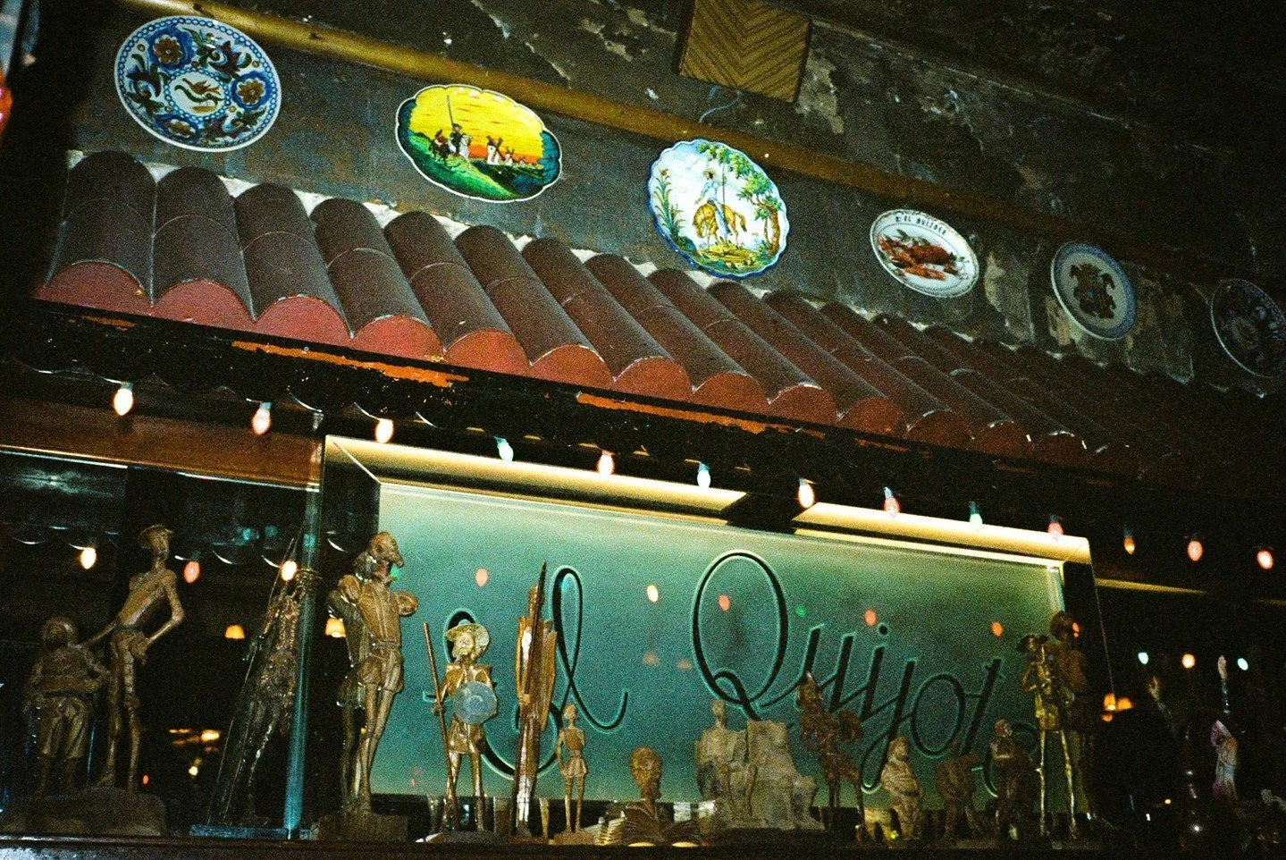 NYC restaurant El Quijote showing historic ceiling, booth seating, four tops, and vintage french chandelier pendant lights. Hospitality interior design and consultancy by Studio Sio, New Zealand