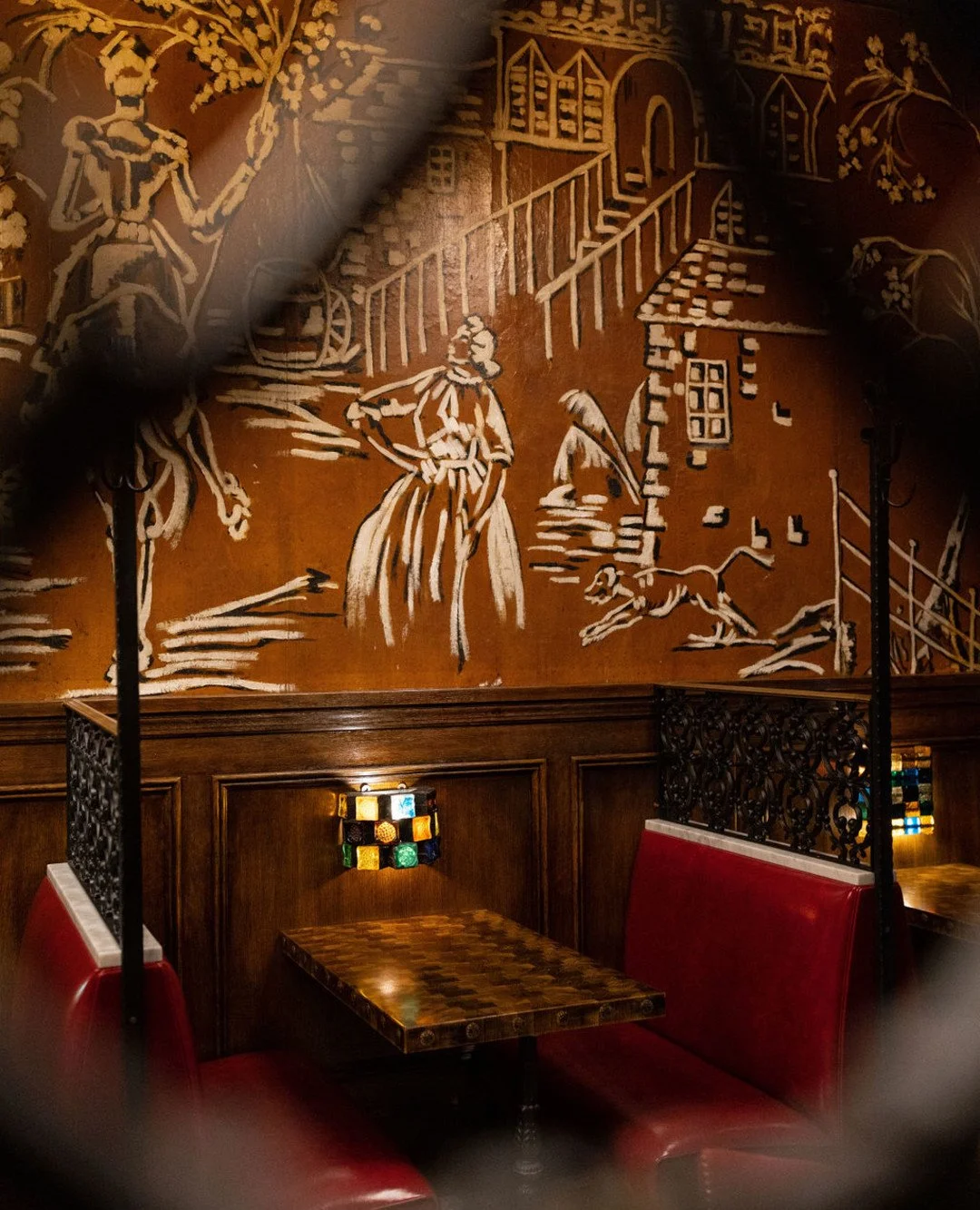 NYC restaurant El Quijote showing historic ceiling, booth seating, four tops, and vintage french chandelier pendant lights. Hospitality interior design and consultancy by Studio Sio, New Zealand