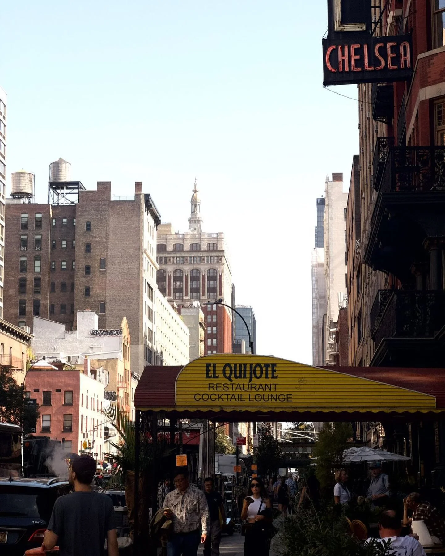NYC restaurant El Quijote showing historic ceiling, booth seating, four tops, and vintage french chandelier pendant lights. Hospitality interior design and consultancy by Studio Sio, New Zealand