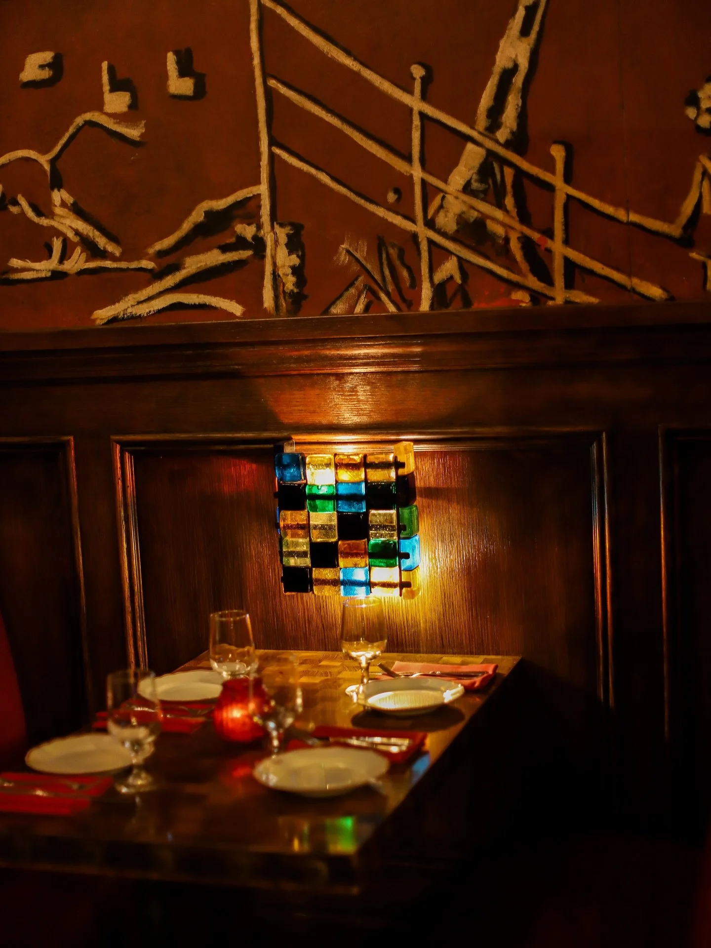 NYC restaurant El Quijote showing historic ceiling, booth seating, four tops, and vintage french chandelier pendant lights. Hospitality interior design and consultancy by Studio Sio, New Zealand