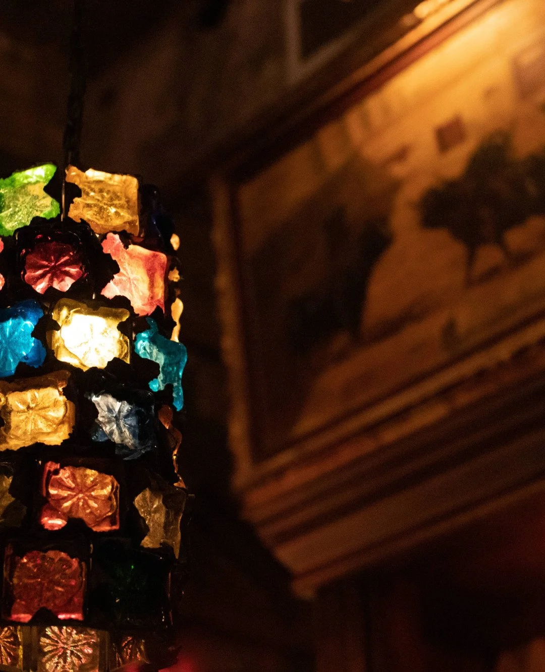 NYC restaurant El Quijote showing historic ceiling, booth seating, four tops, and vintage french chandelier pendant lights. Hospitality interior design and consultancy by Studio Sio, New Zealand