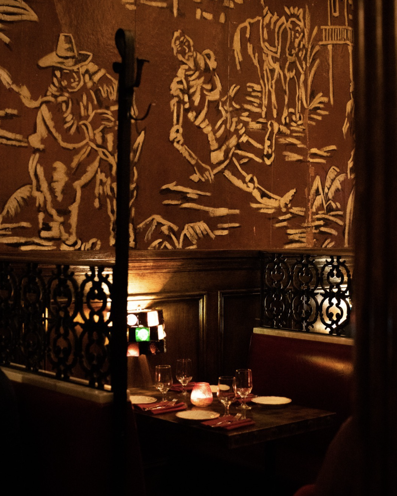 NYC restaurant El Quijote showing historic ceiling, booth seating, four tops, and vintage french chandelier pendant lights. Hospitality interior design and consultancy by Studio Sio, New Zealand