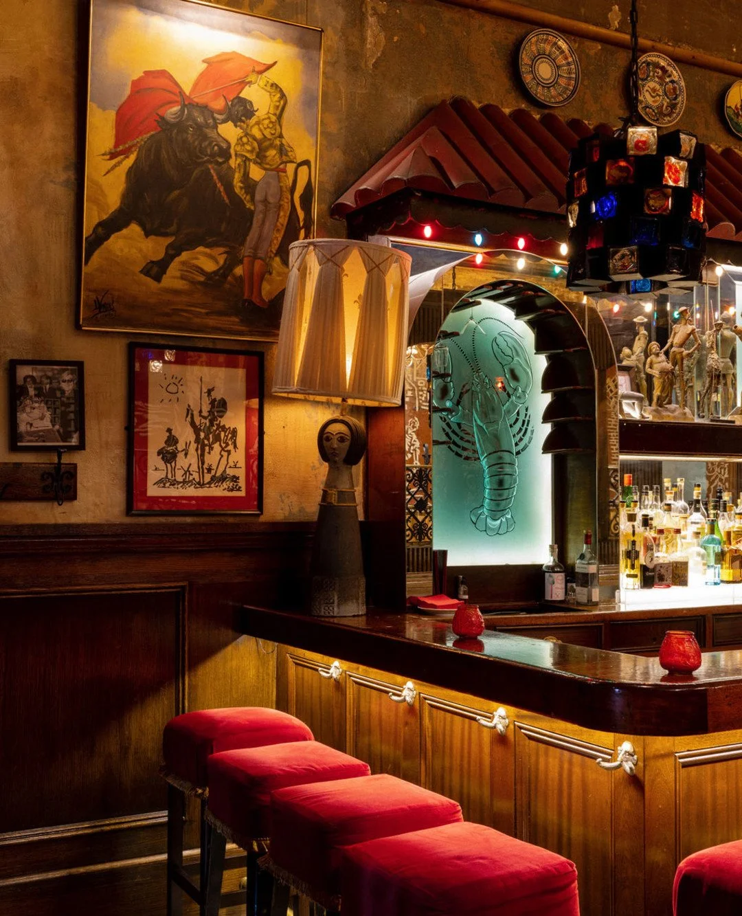 NYC restaurant El Quijote showing historic ceiling, booth seating, four tops, and vintage french chandelier pendant lights. Hospitality interior design and consultancy by Studio Sio, New Zealand