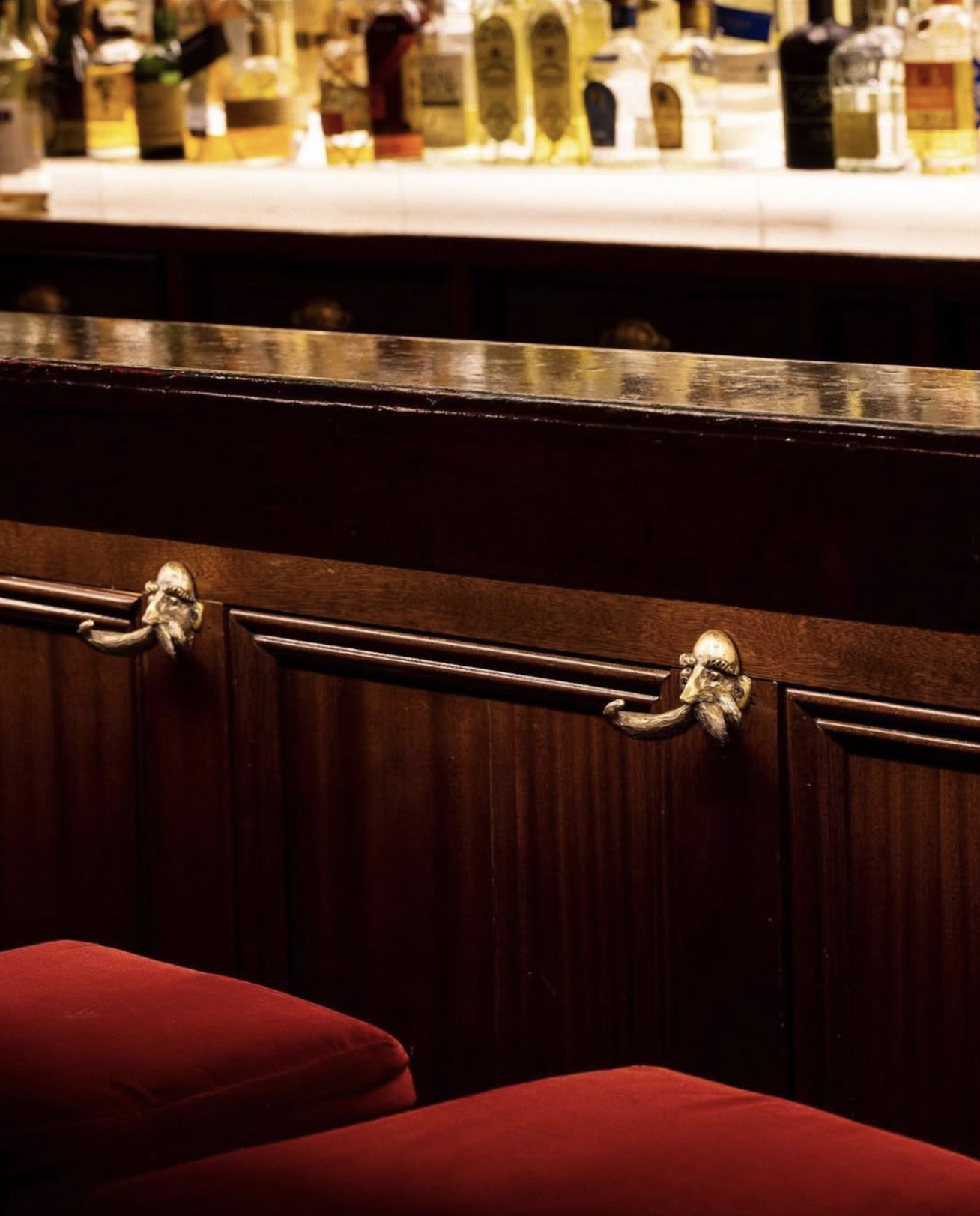 NYC restaurant El Quijote showing historic ceiling, booth seating, four tops, and vintage french chandelier pendant lights. Hospitality interior design and consultancy by Studio Sio, New Zealand