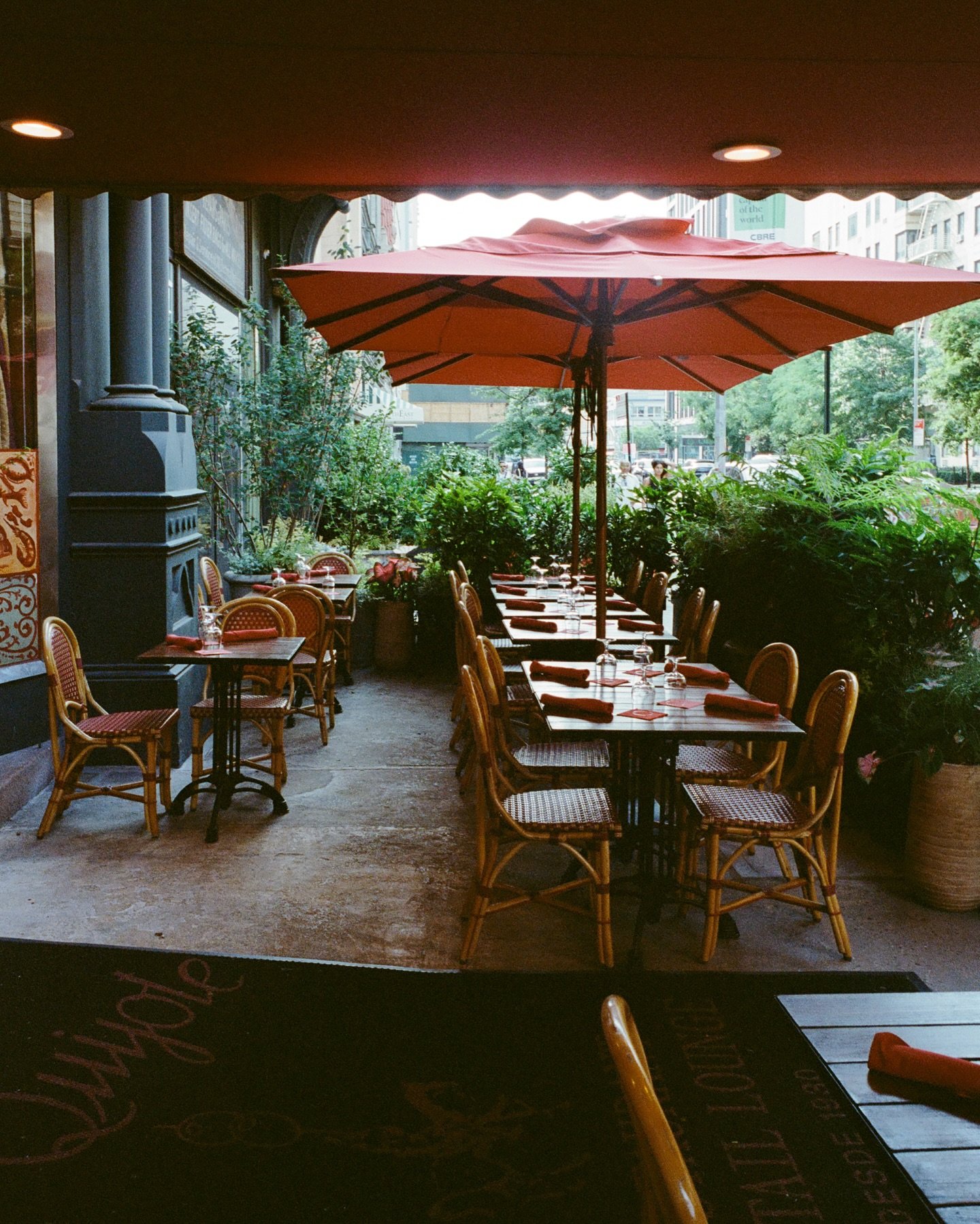NYC restaurant El Quijote showing historic ceiling, booth seating, four tops, and vintage french chandelier pendant lights. Hospitality interior design and consultancy by Studio Sio, New Zealand