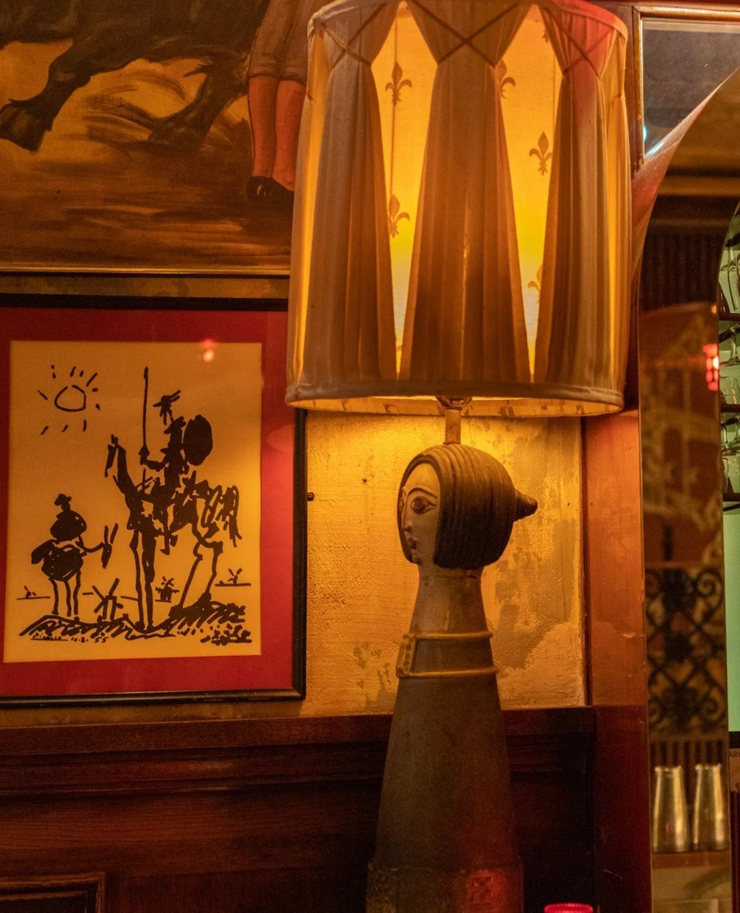 NYC restaurant El Quijote showing historic ceiling, booth seating, four tops, and vintage french chandelier pendant lights. Hospitality interior design and consultancy by Studio Sio, New Zealand