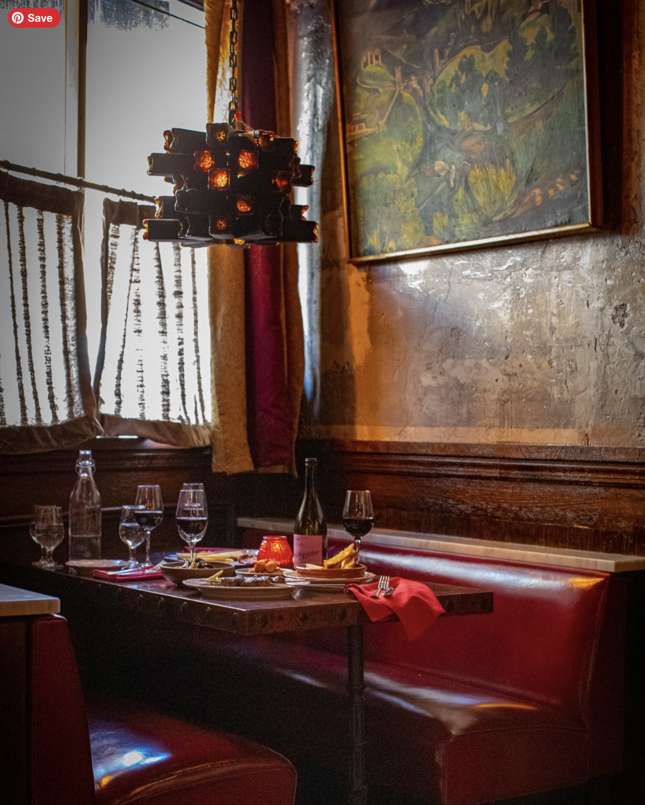 NYC restaurant El Quijote showing historic ceiling, booth seating, four tops, and vintage french chandelier pendant lights. Hospitality interior design and consultancy by Studio Sio, New Zealand