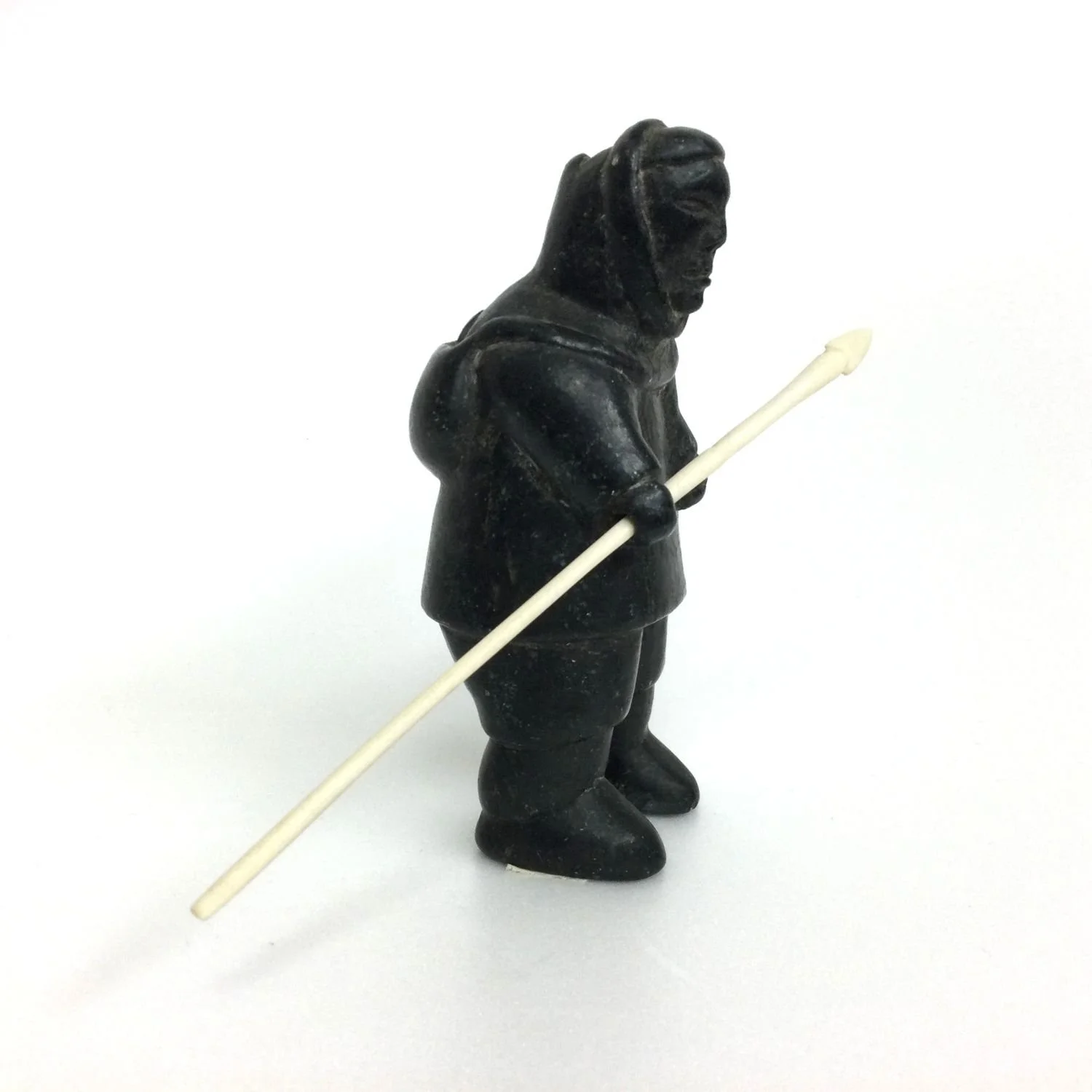 Conlucy Nayoumealook E9-1572 (1940-66) Inukjuak/Port Harrison, ᐃᓄᒃᔪᐊᒃ, Hunter (#26.1.1M), c.1958, serpentine and antler, 4.75 x 4.5 x 4 inches (12 x 11.5 x 10 cm) with spear, provenance: private collection Saskatchewan, $950 Cdn.