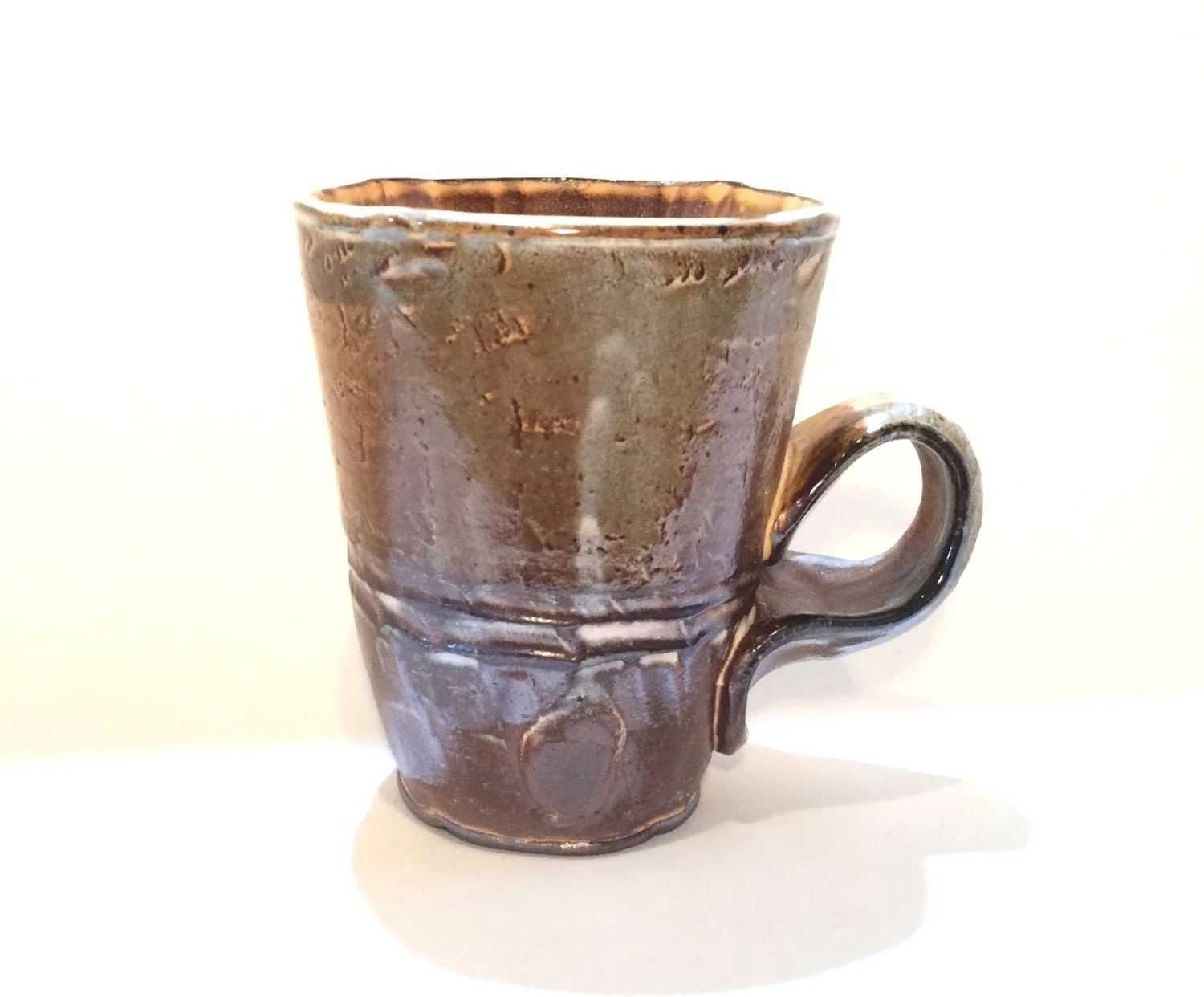 Confluence - Straight Mug (#26.2.65), 2026, low soda-fired earthenware, 4.25 x 4.75 x 3.25 inches (11 x 12 x 9 cm), $85 Cdn.